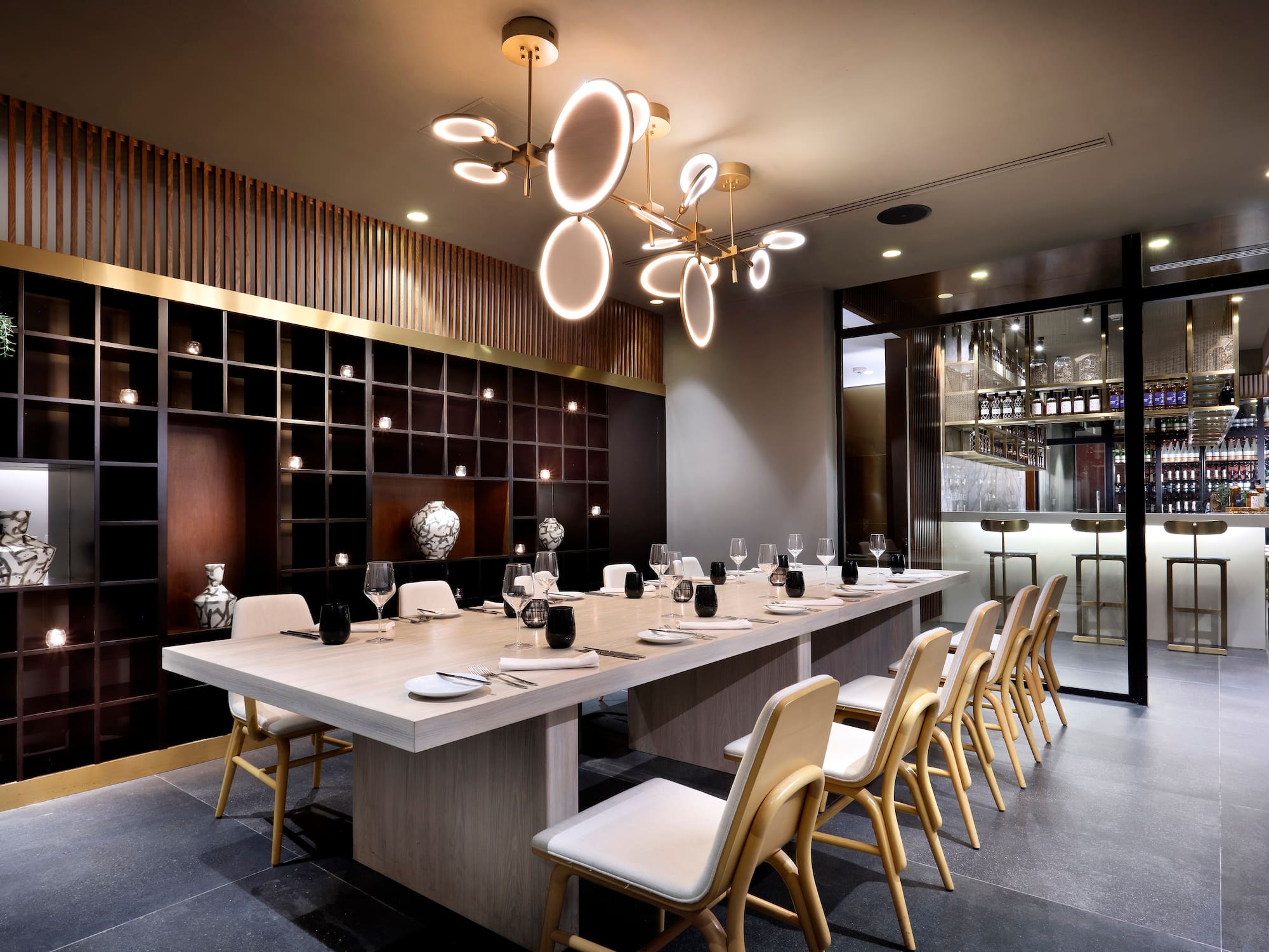 a large table with plates and chairs in a room