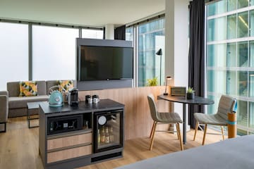 a room with a tv and a table