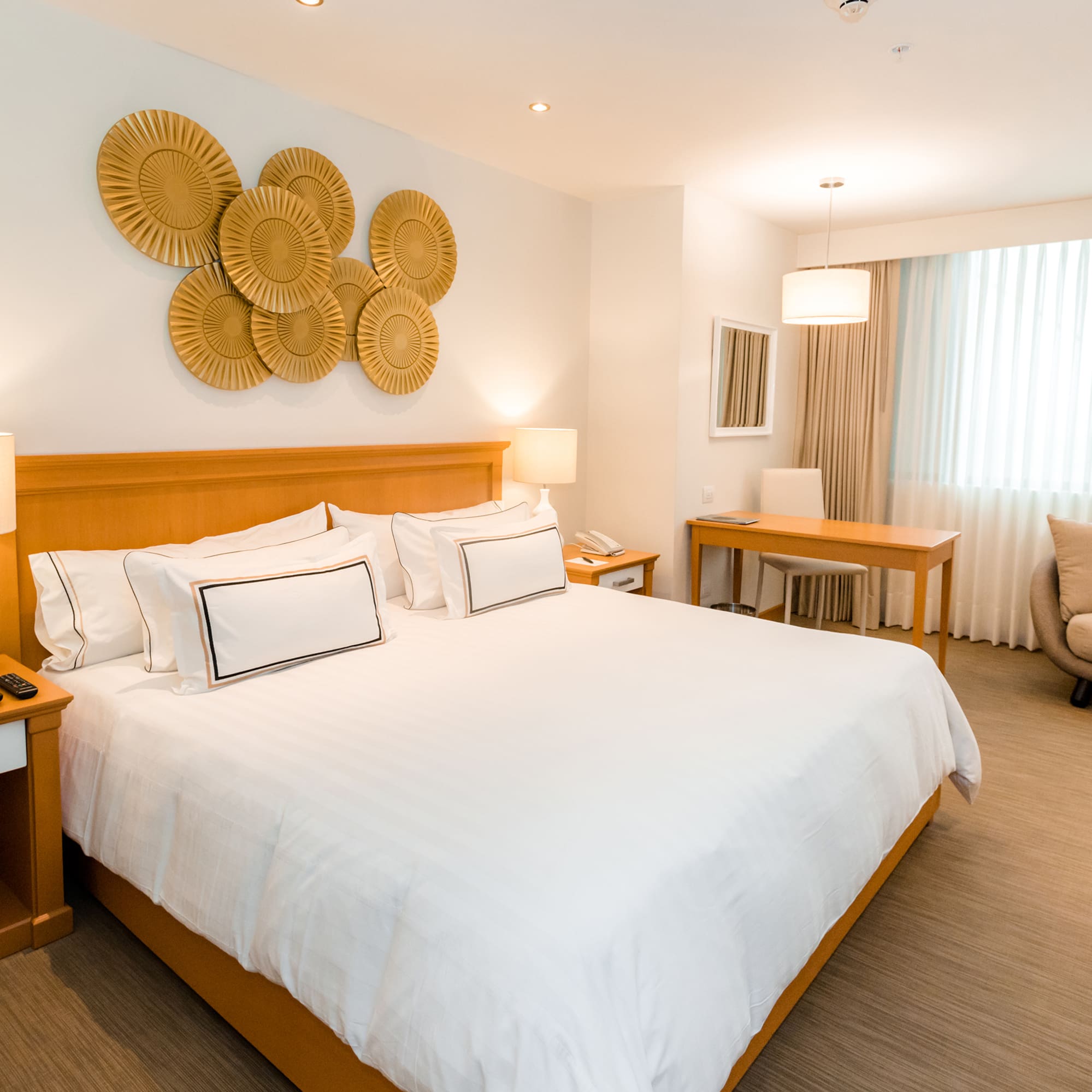 a bedroom with a bed and a chair