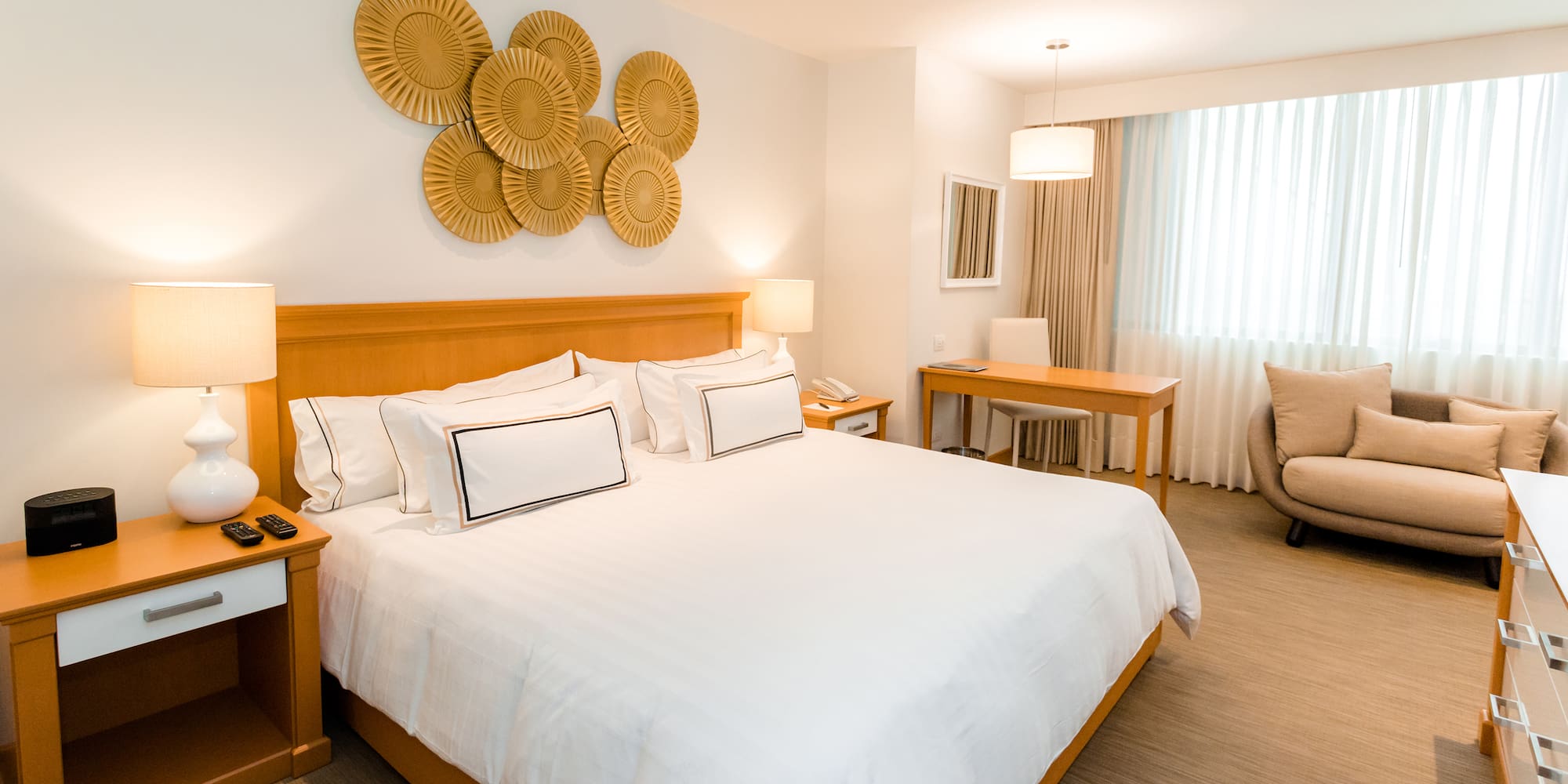 a bedroom with a bed and a chair