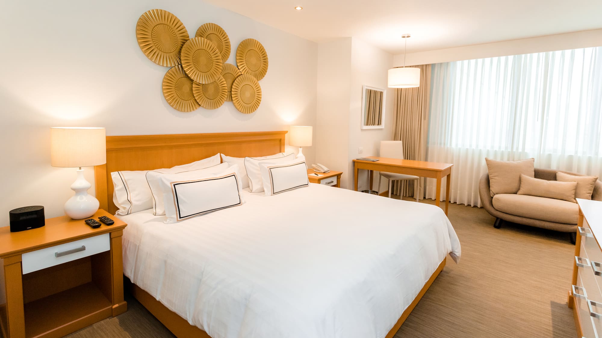 a bedroom with a bed and a chair