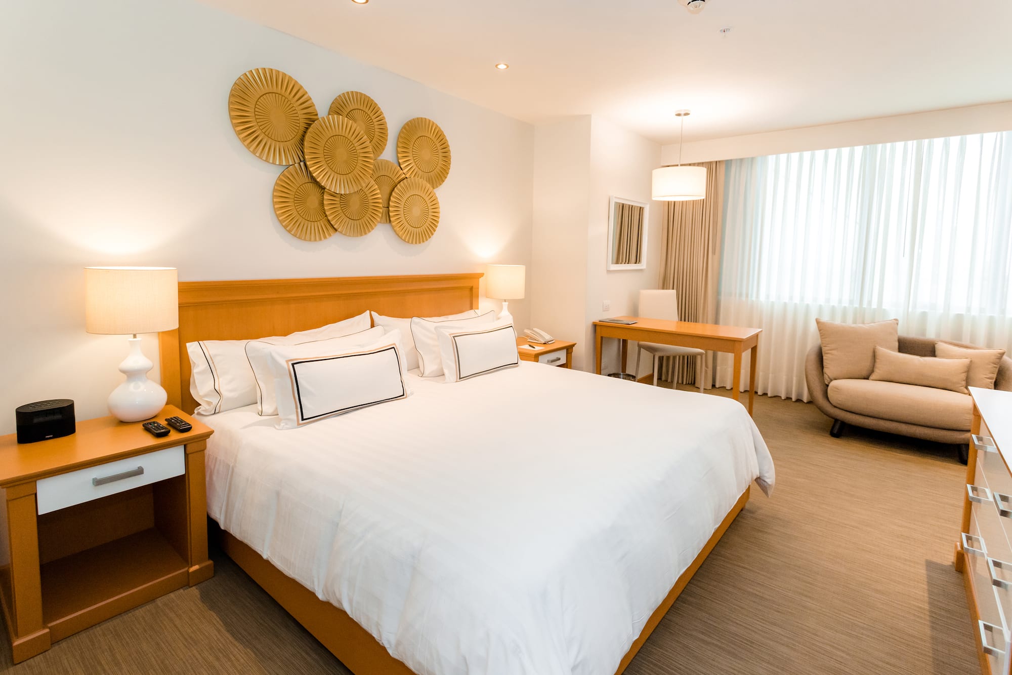 a bedroom with a bed and a chair