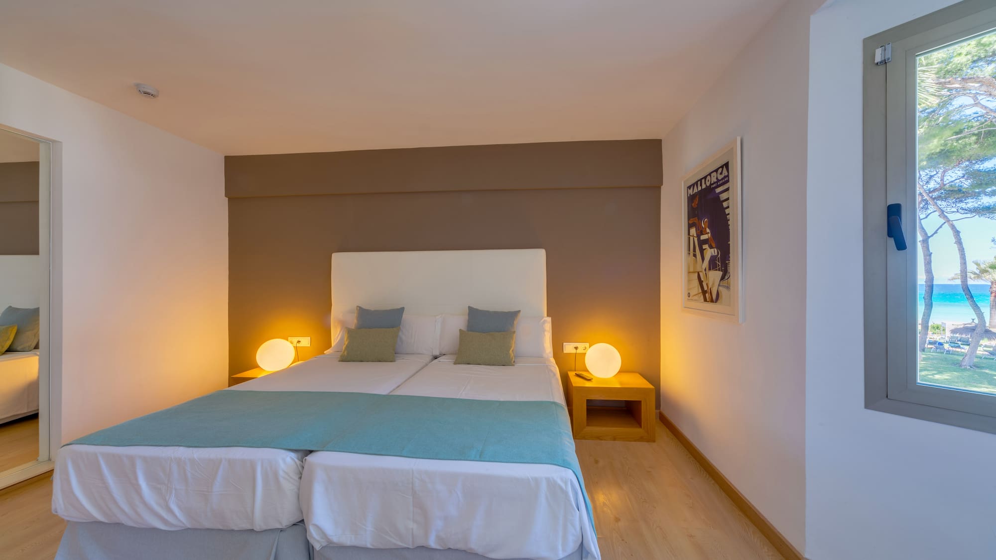 a bed with two pillows in a room