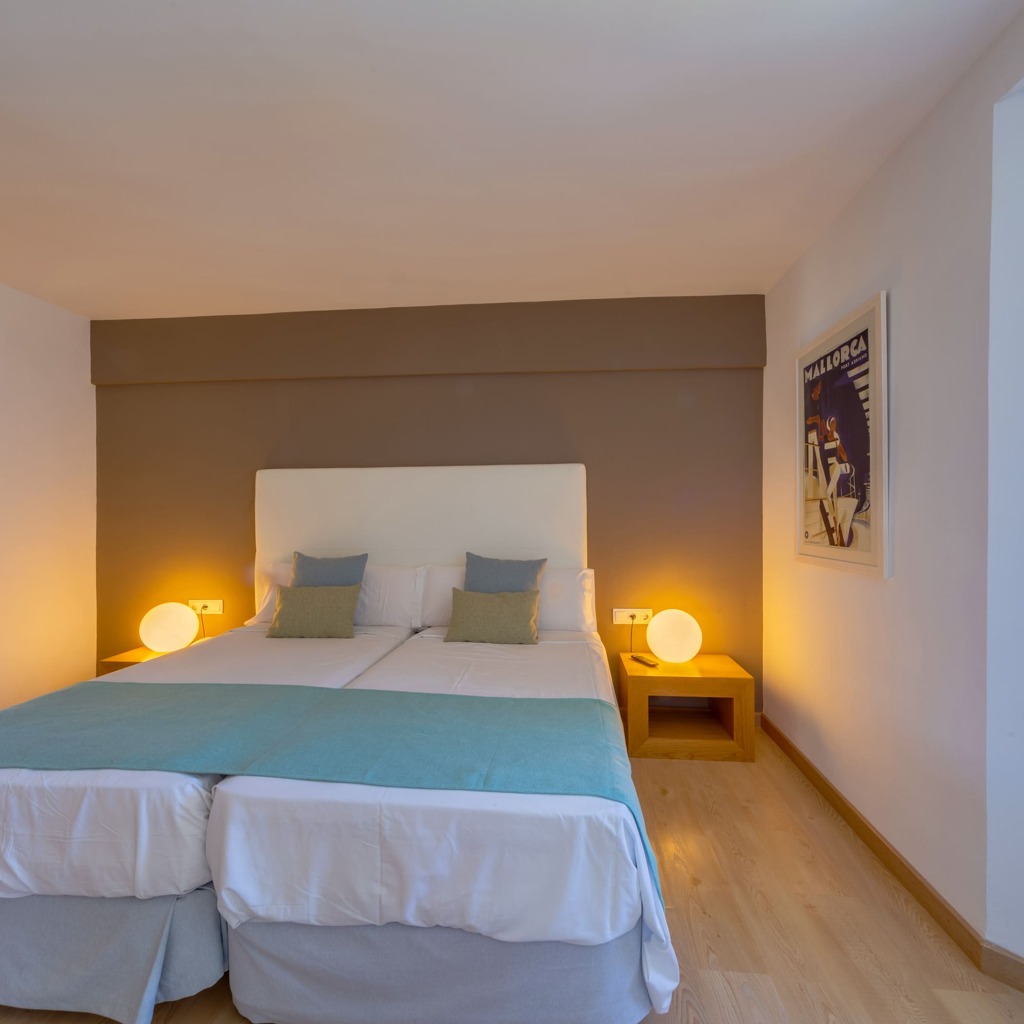 a bed with two pillows in a room