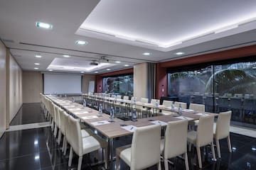 a room with a large table and chairs