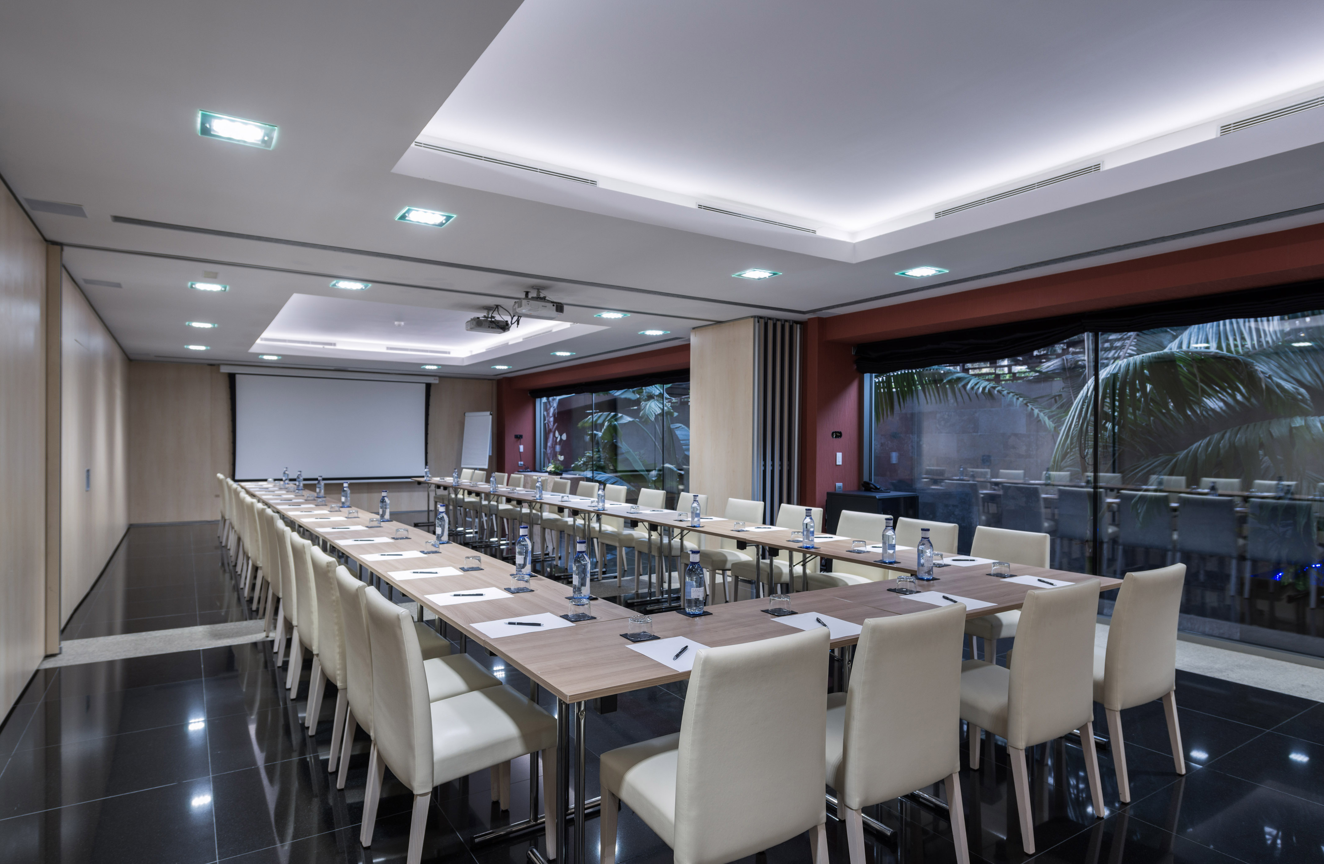 a room with a large table and chairs