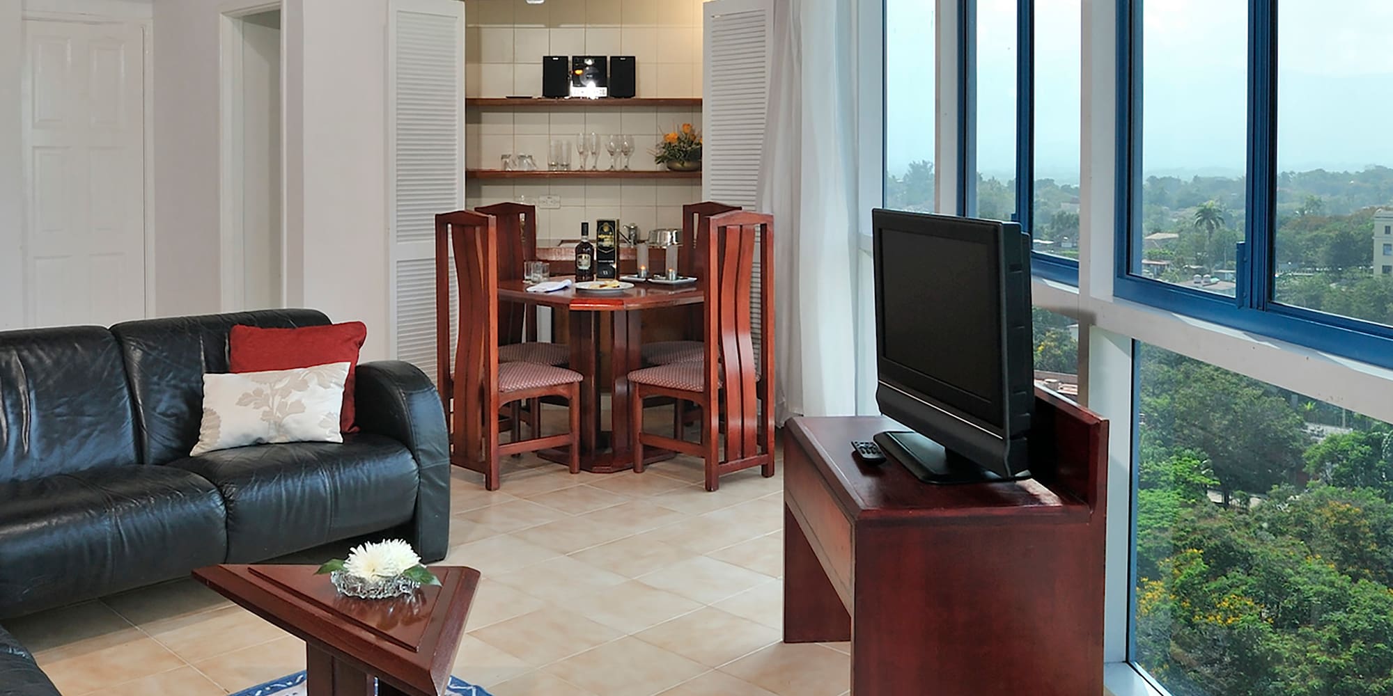a living room with a tv and a table