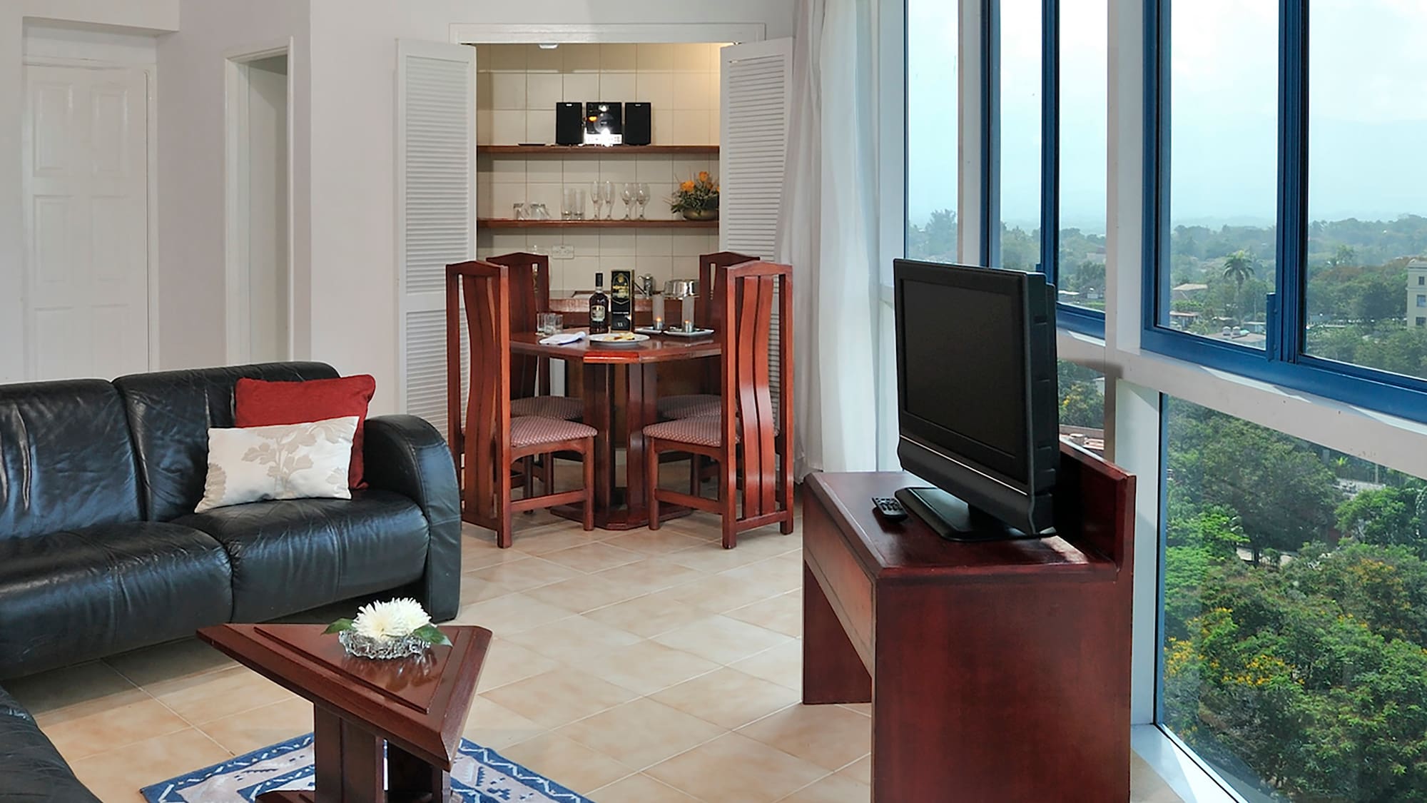 a living room with a tv and a table