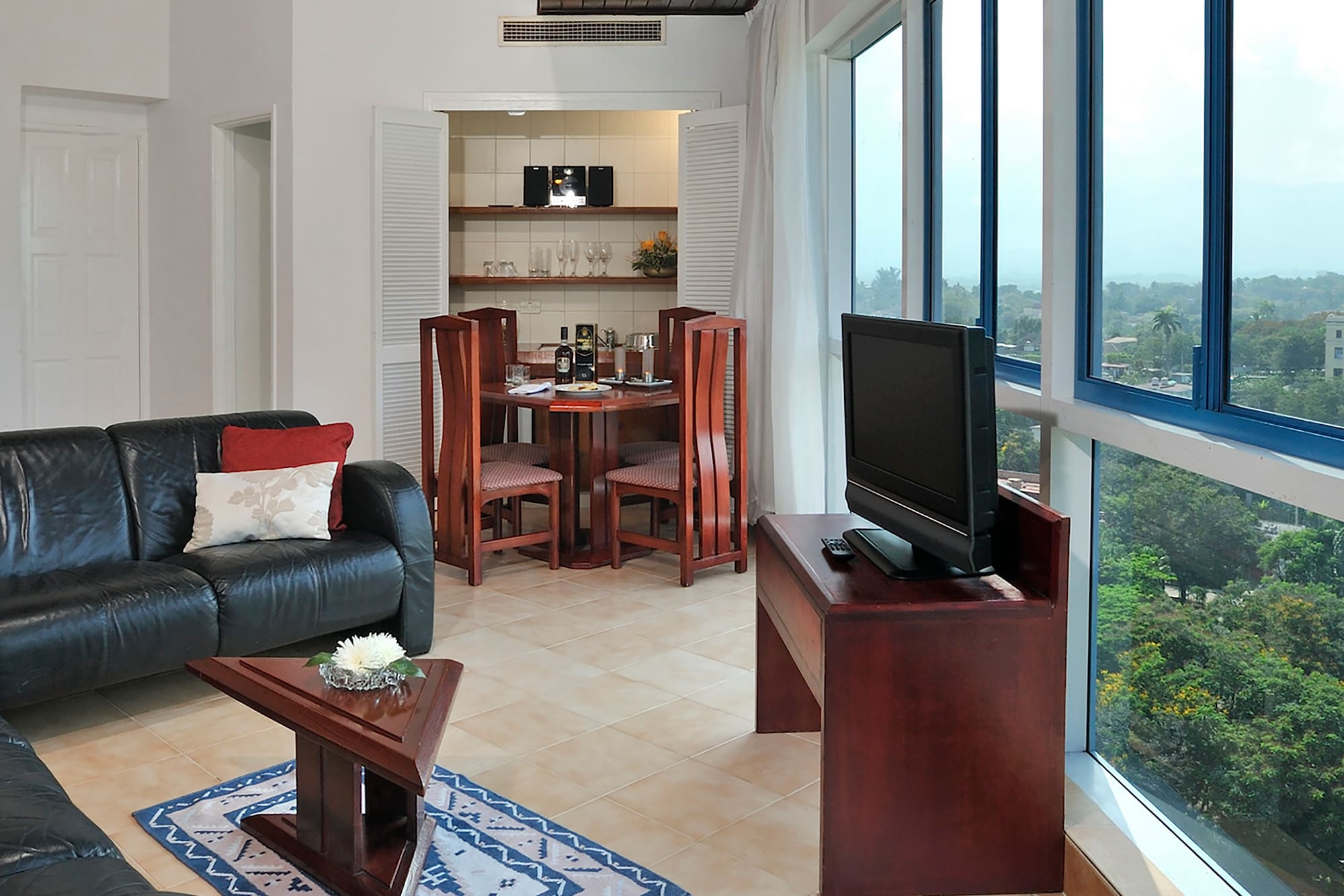 a living room with a tv and a table