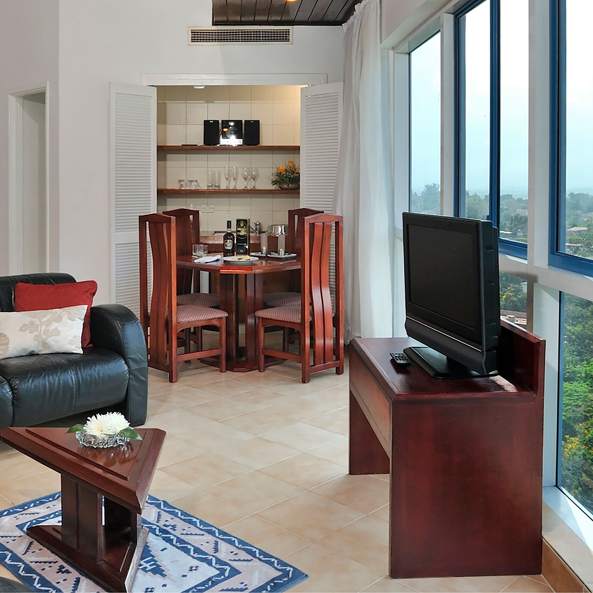 a living room with a tv and a table