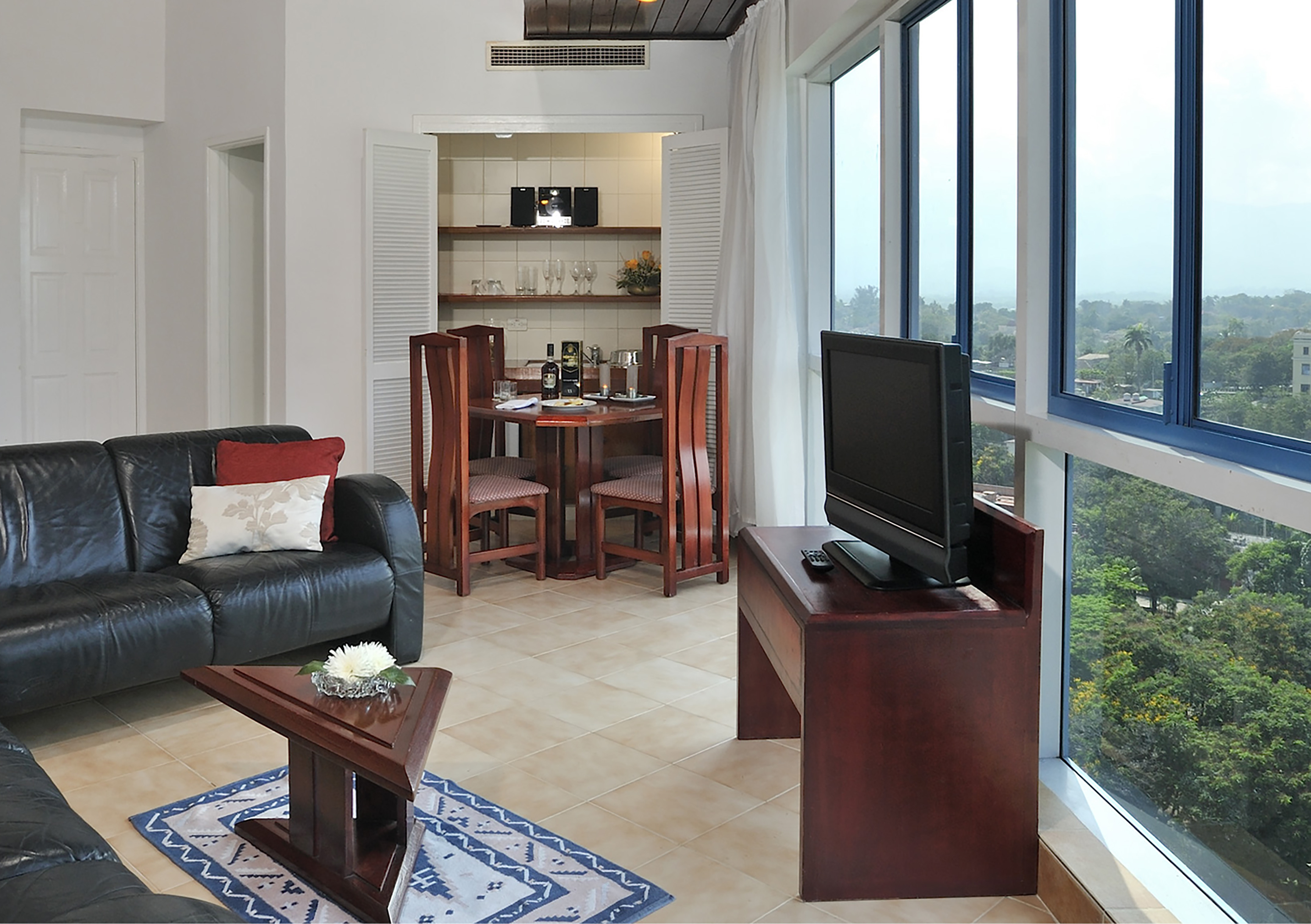 a living room with a tv and a table
