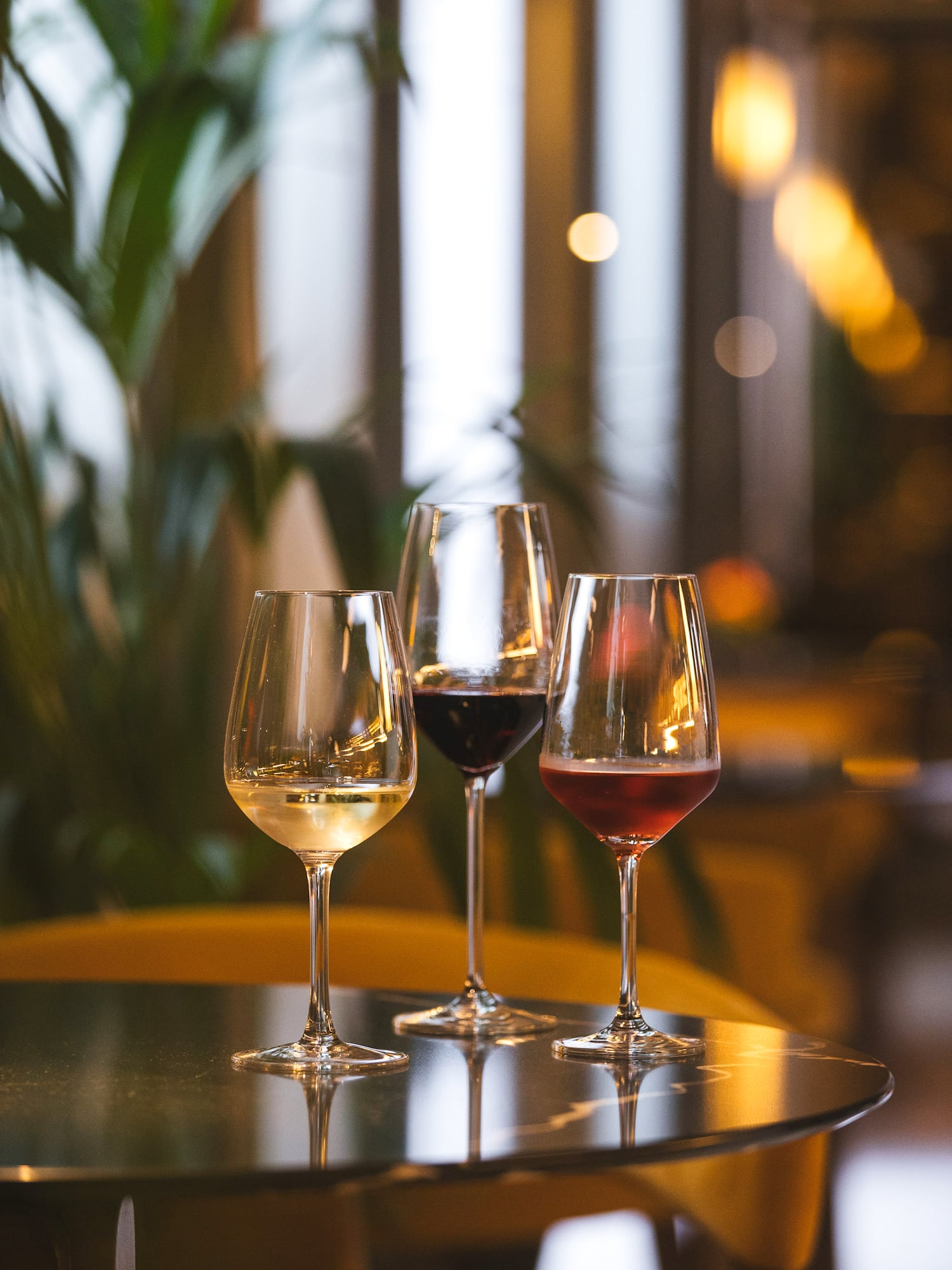a group of wine glasses on a table