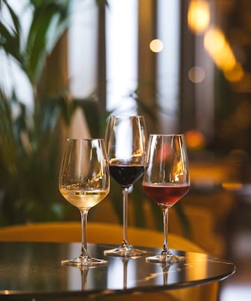 a group of wine glasses on a table