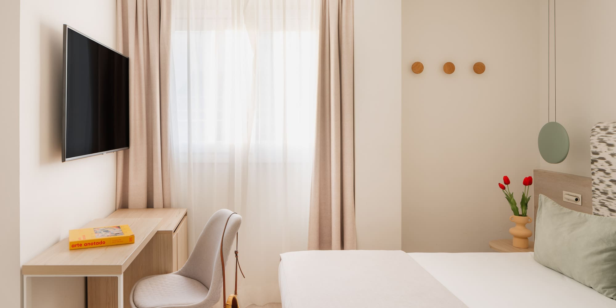 a room with a tv and a bed