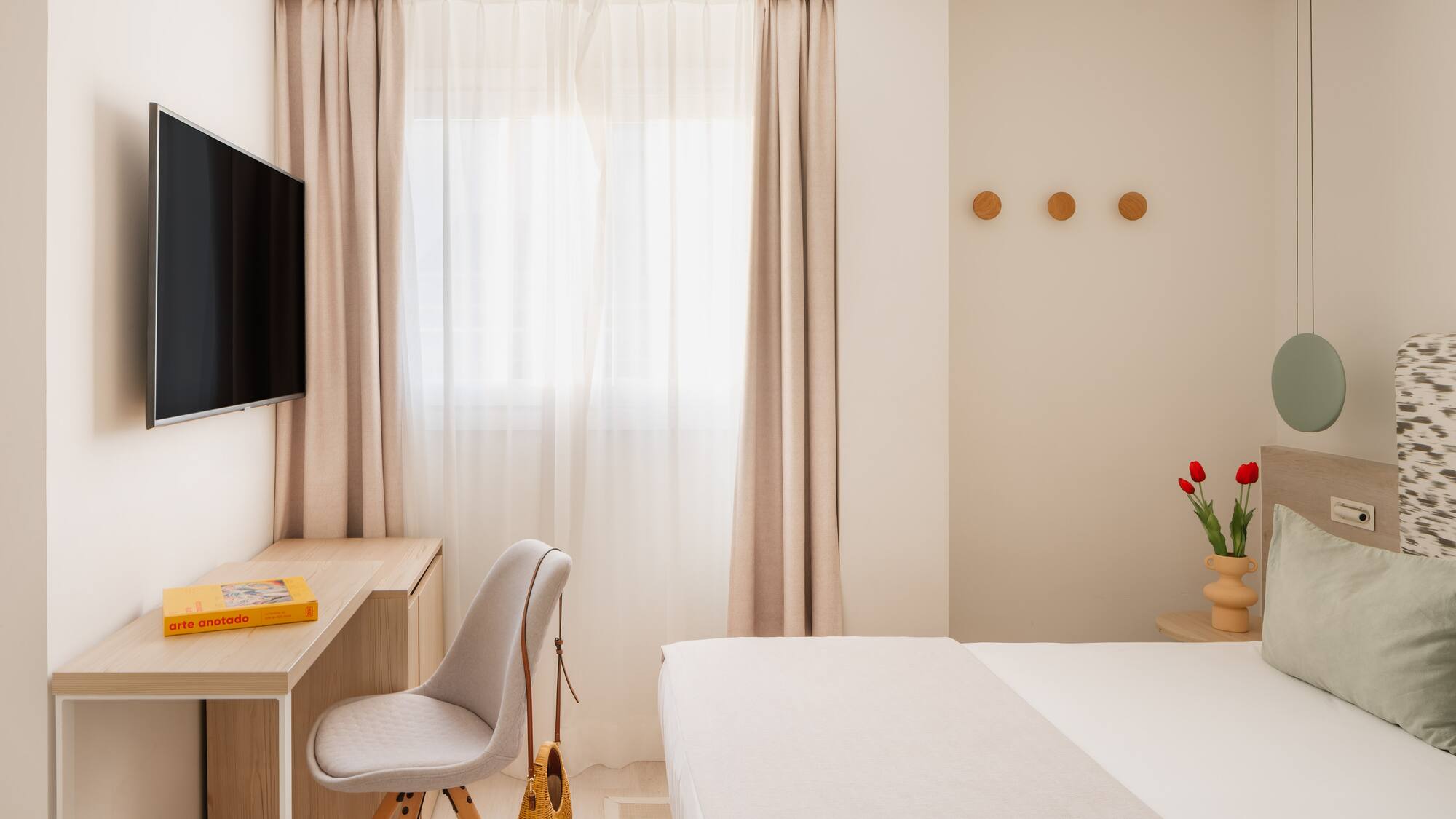 a room with a tv and a bed