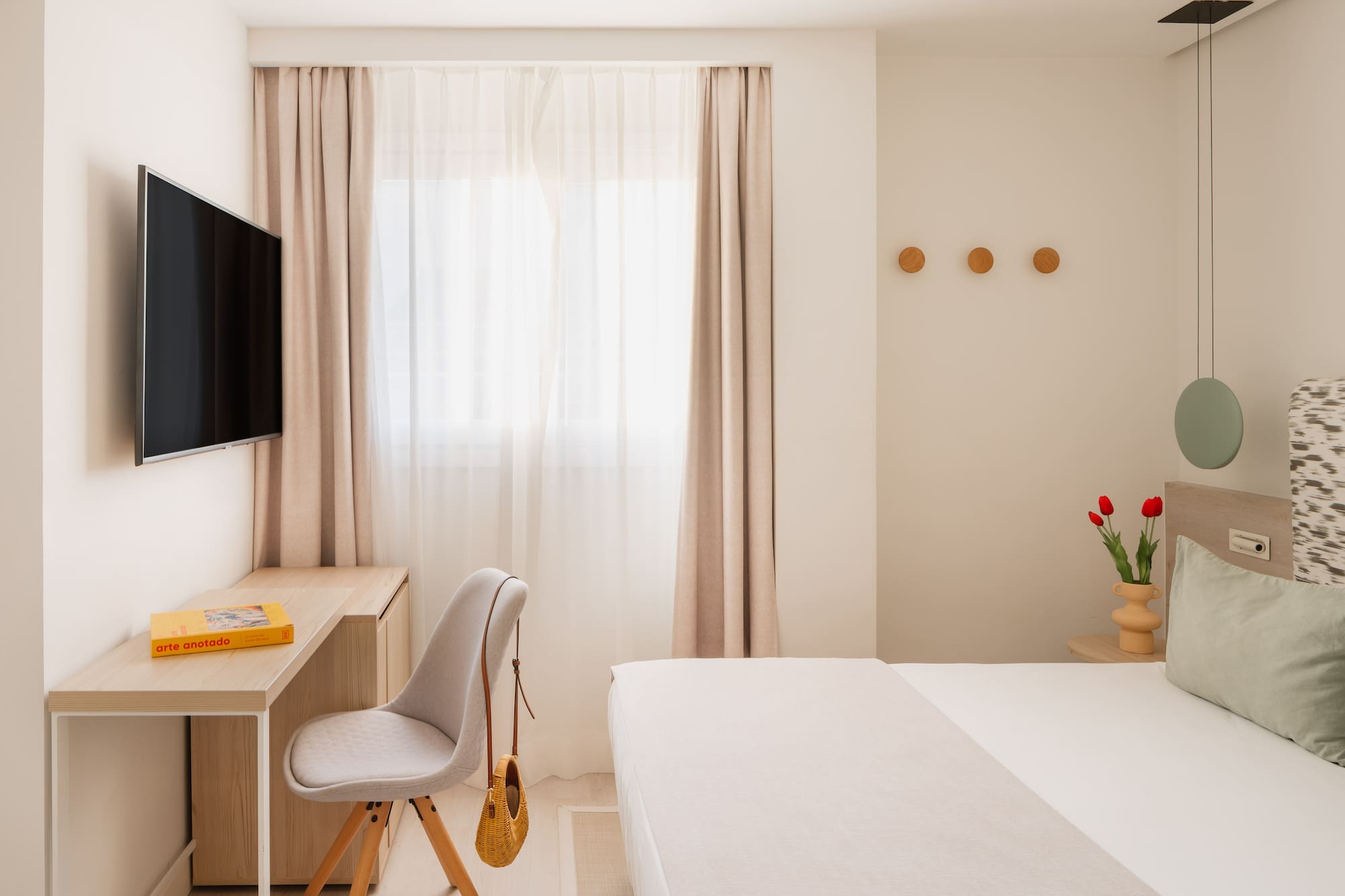 a room with a tv and a bed