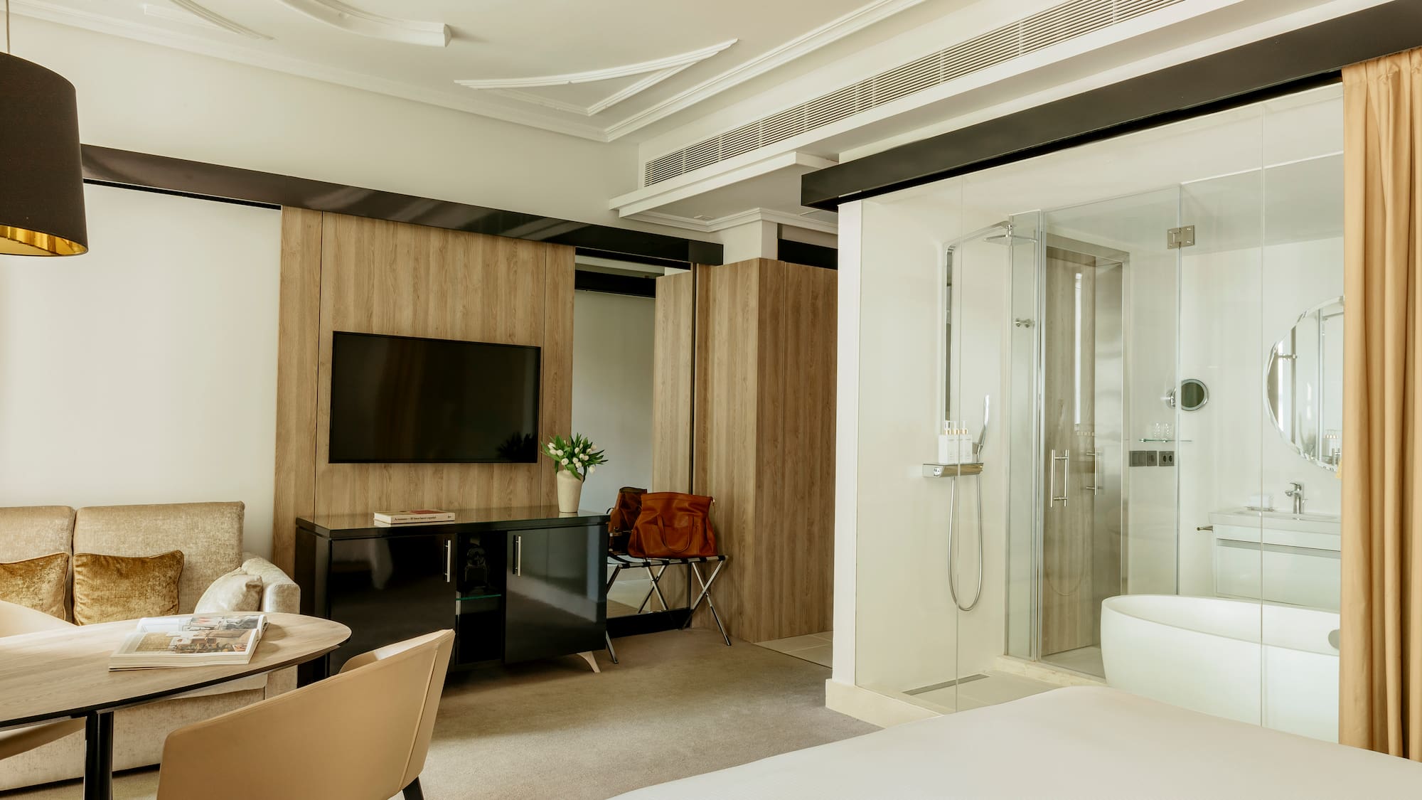 a room with a bed and a tv