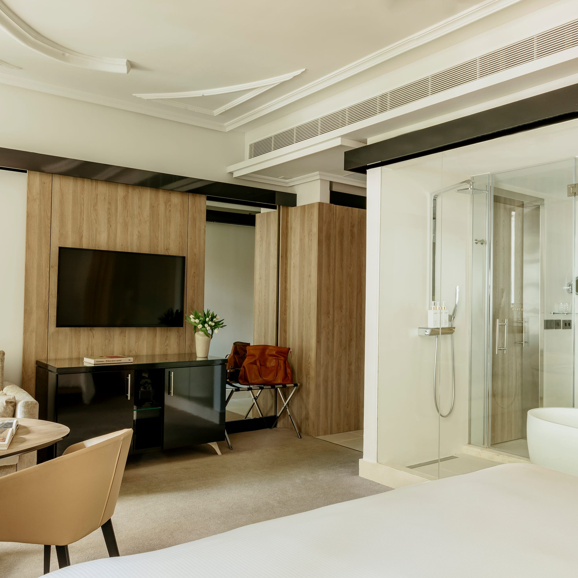 a room with a bed and a tv