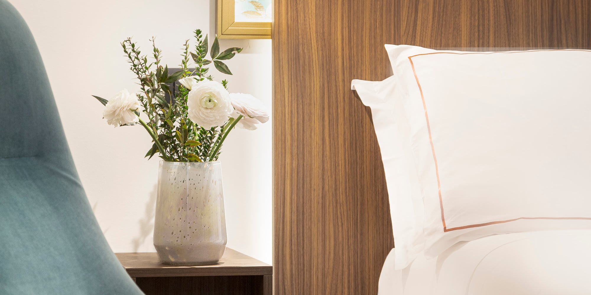 Junior Suite details chair next to a bed