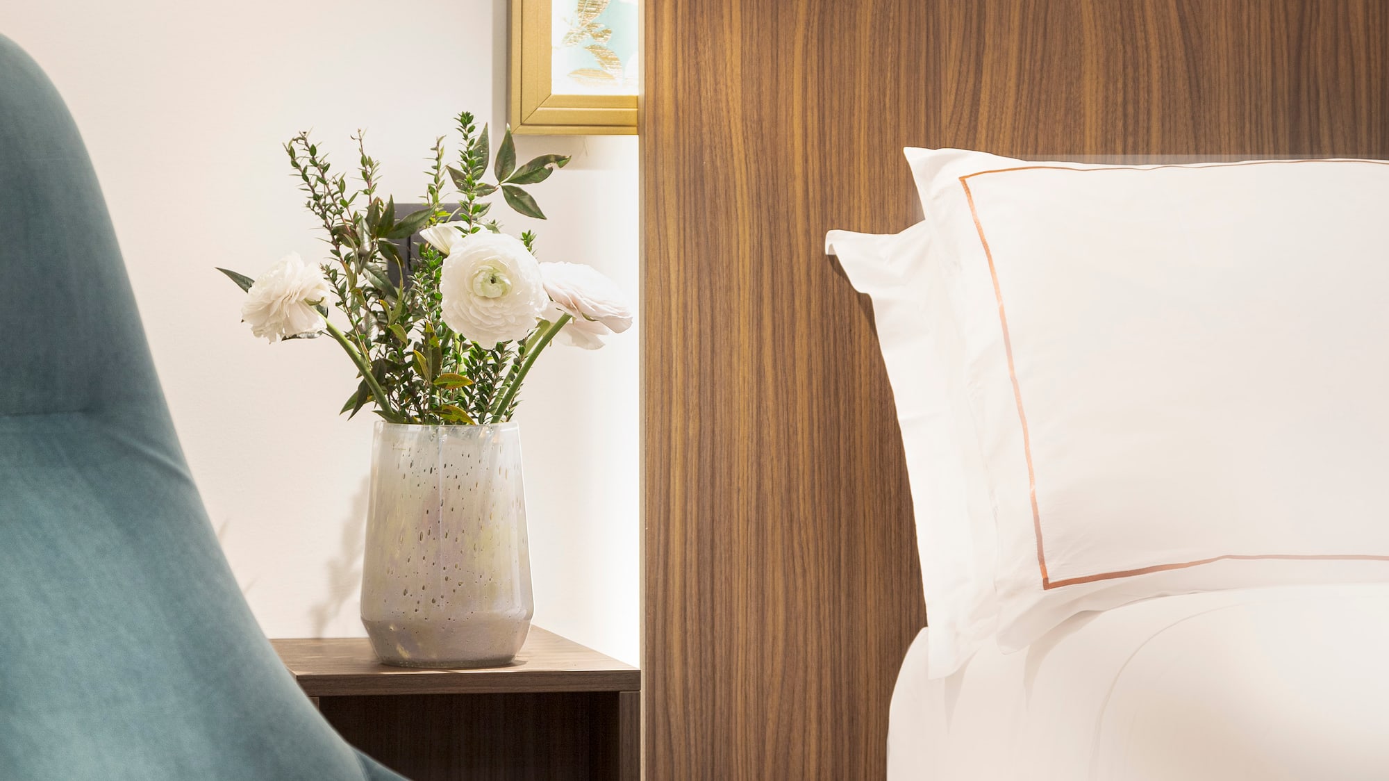 Junior Suite details chair next to a bed