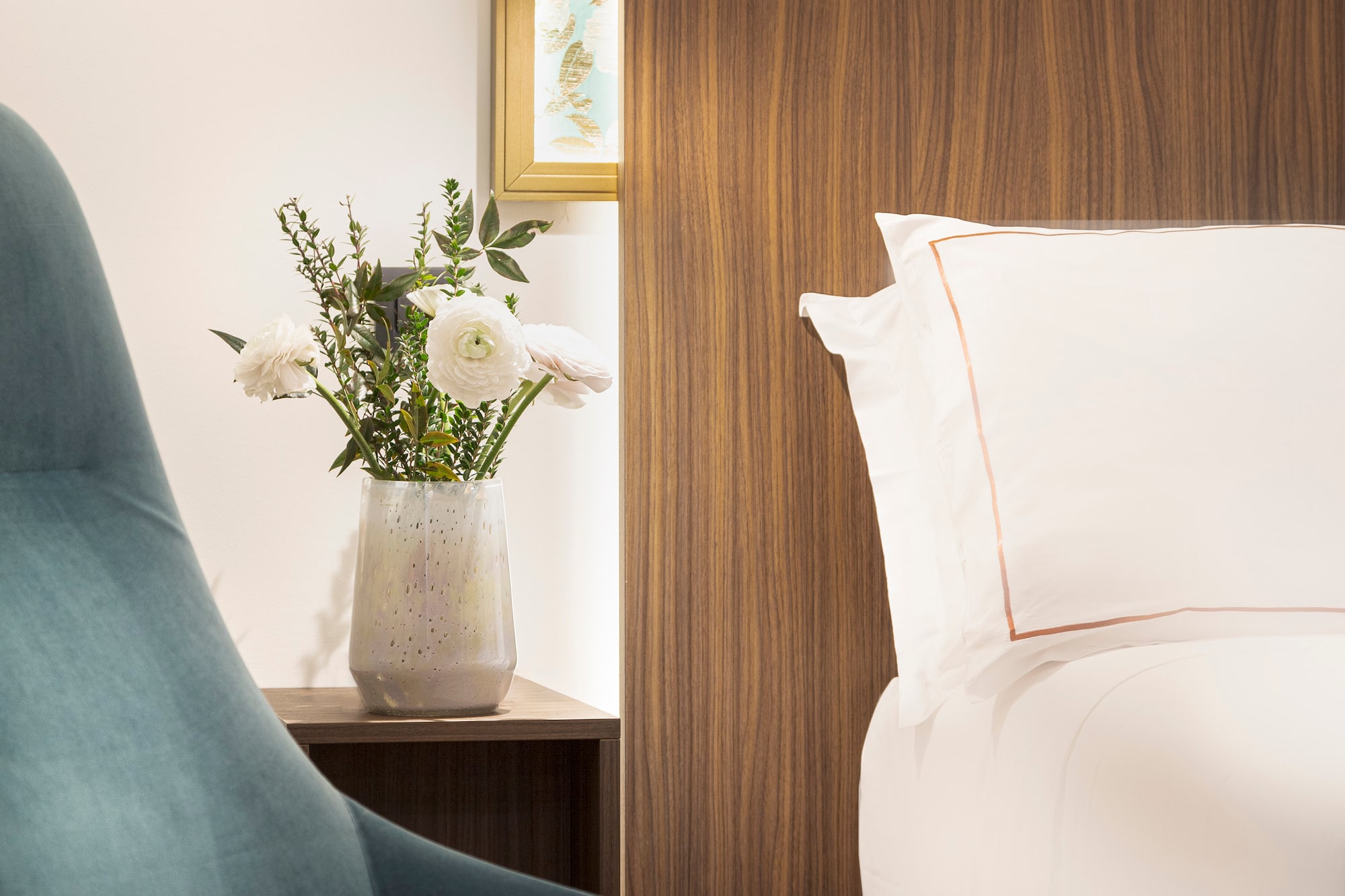 Junior Suite details chair next to a bed