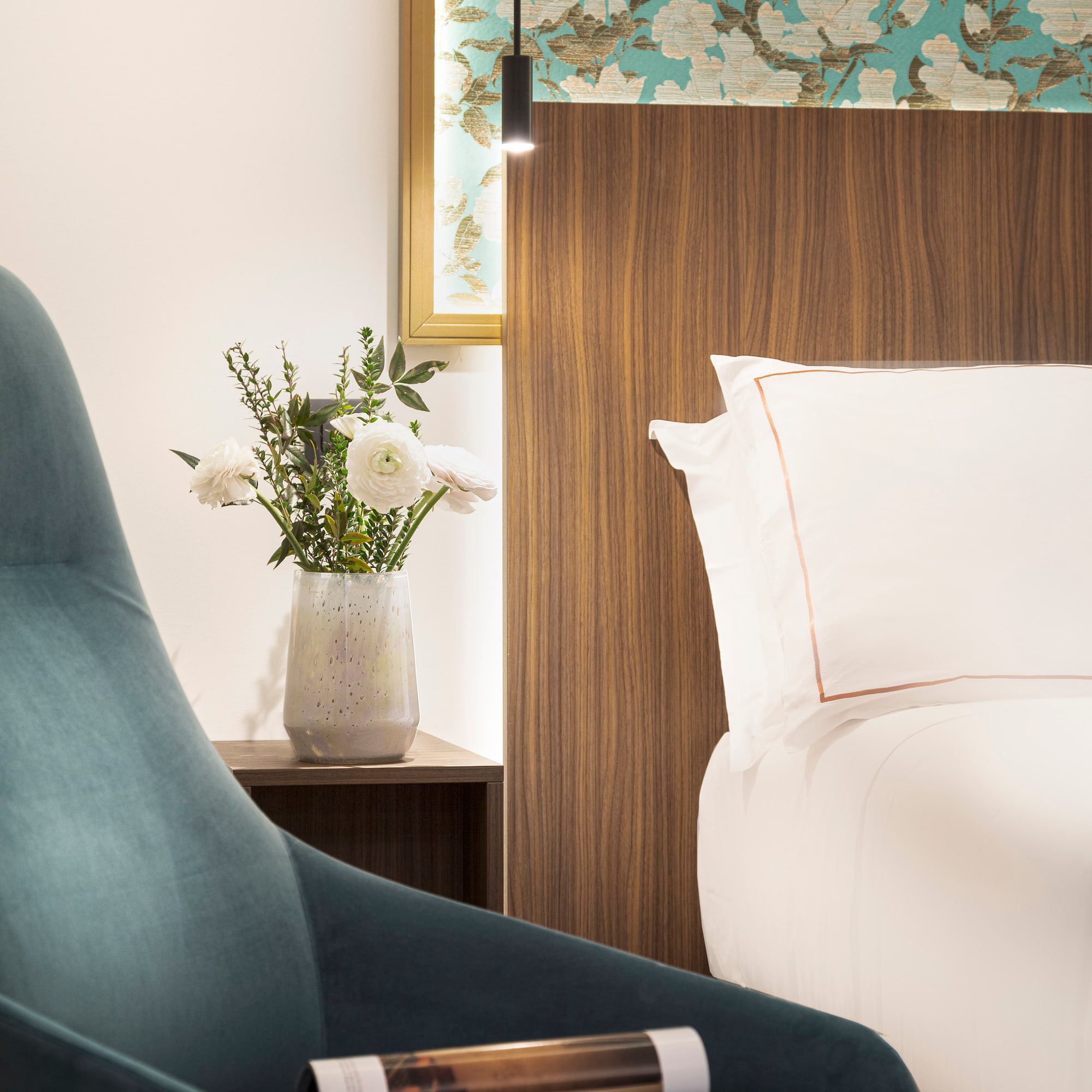 Junior Suite details chair next to a bed