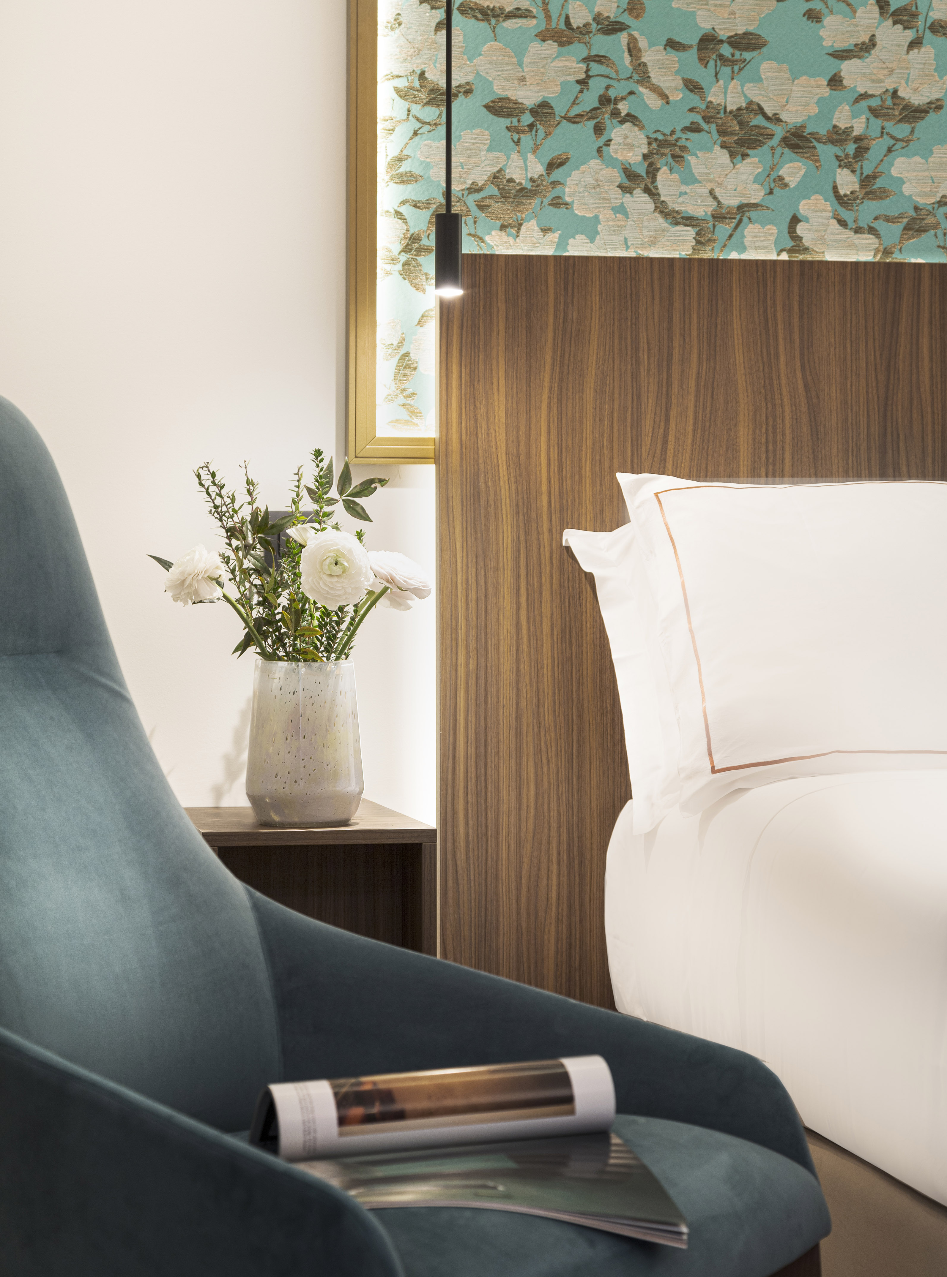 Junior Suite details chair next to a bed