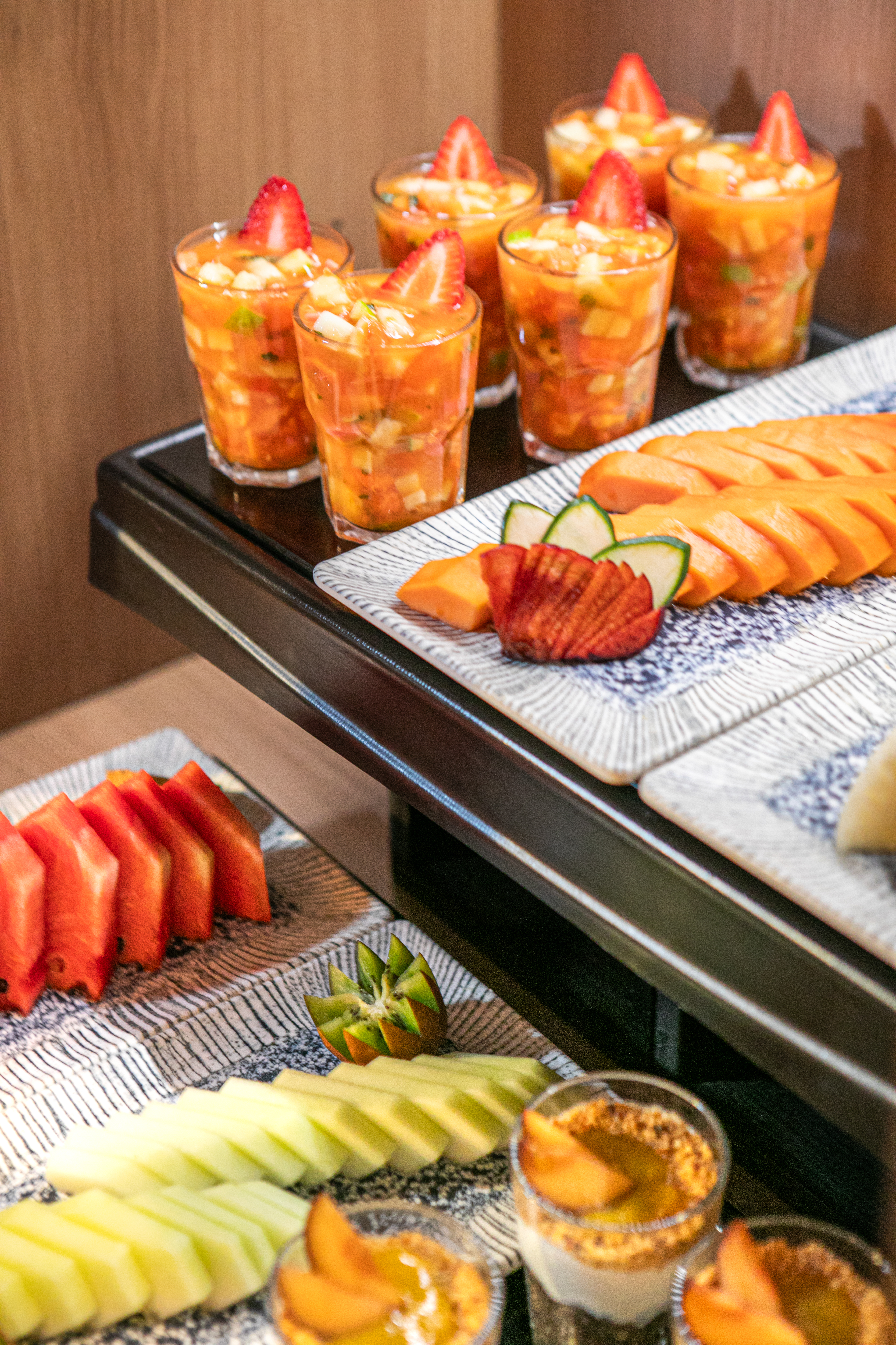 a tray of fruit and drinks