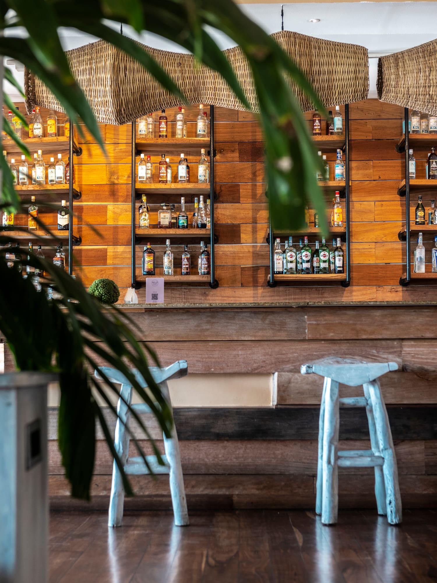 a bar with a shelf of liquor