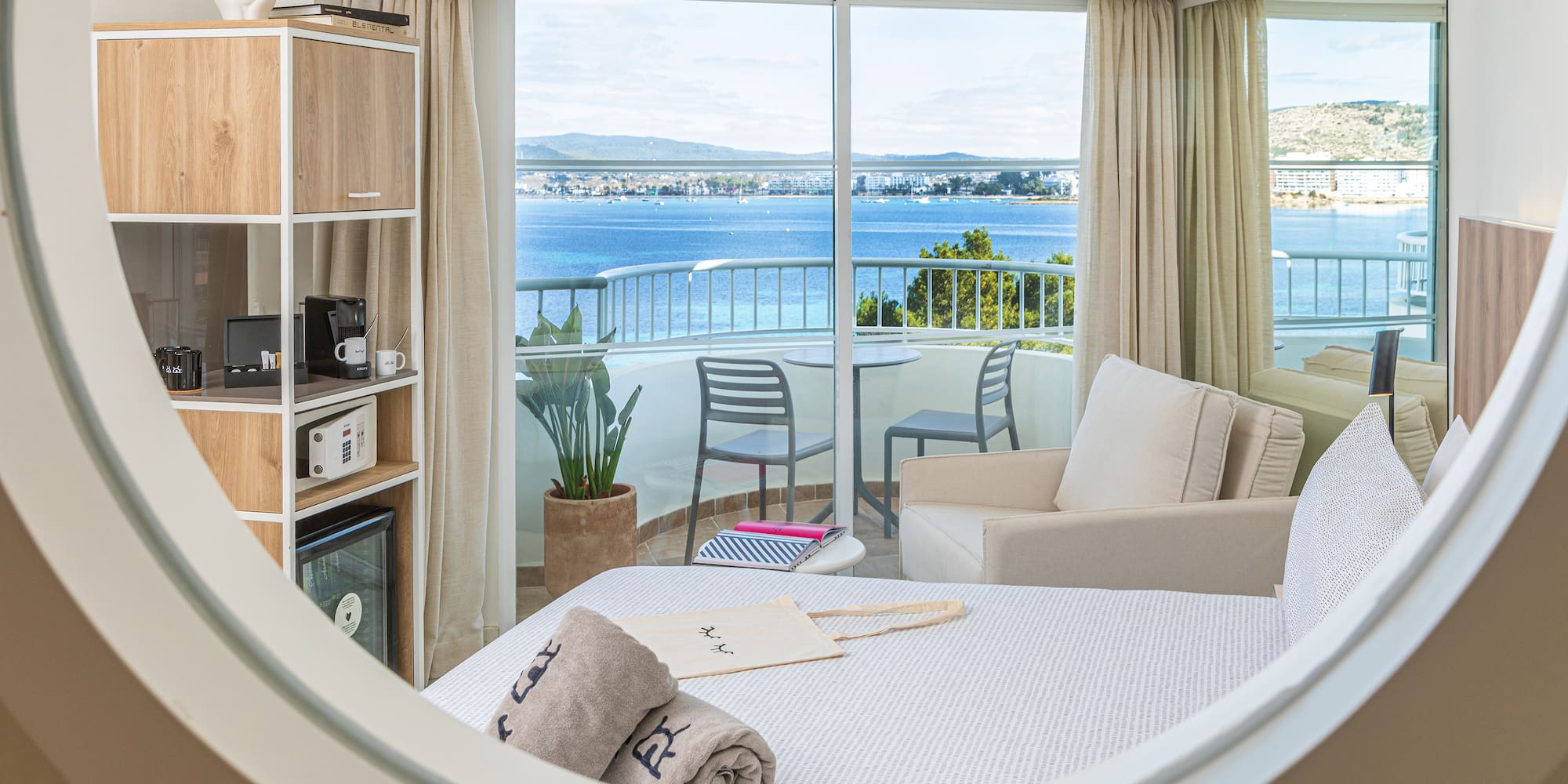 a room with a view of the ocean from a window