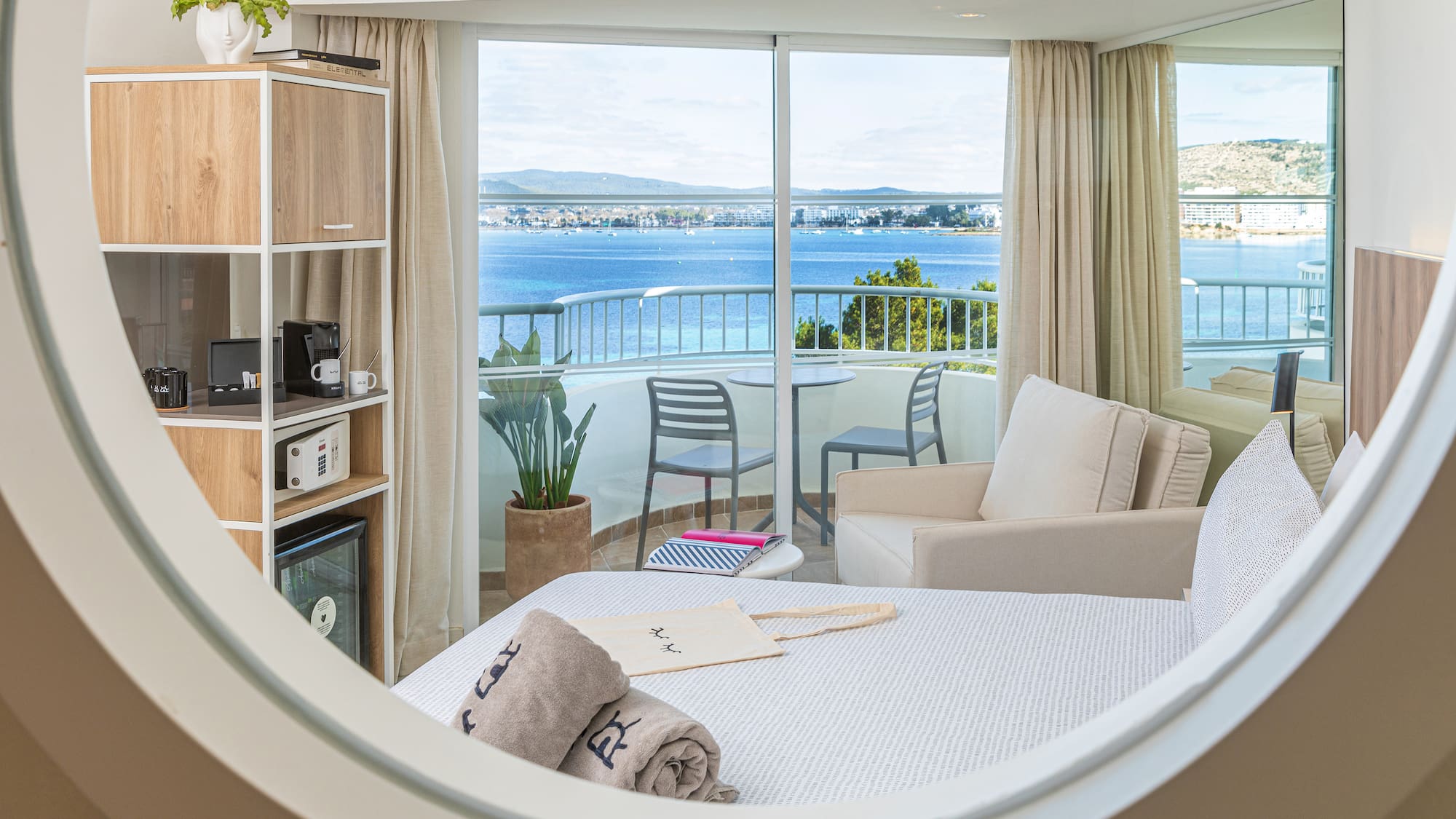 a room with a view of the ocean from a window