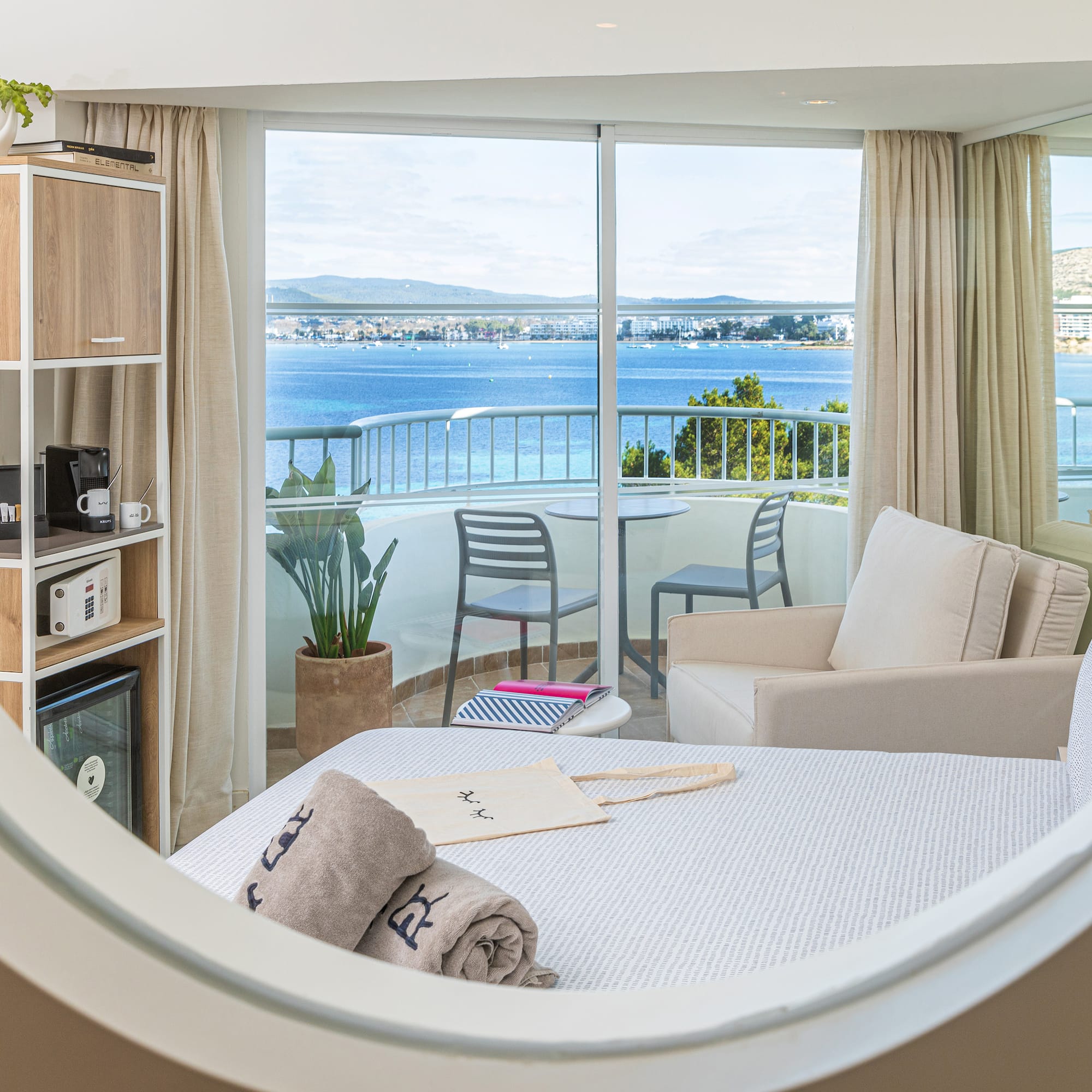 a room with a view of the ocean from a window