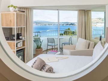 a room with a view of the ocean from a window