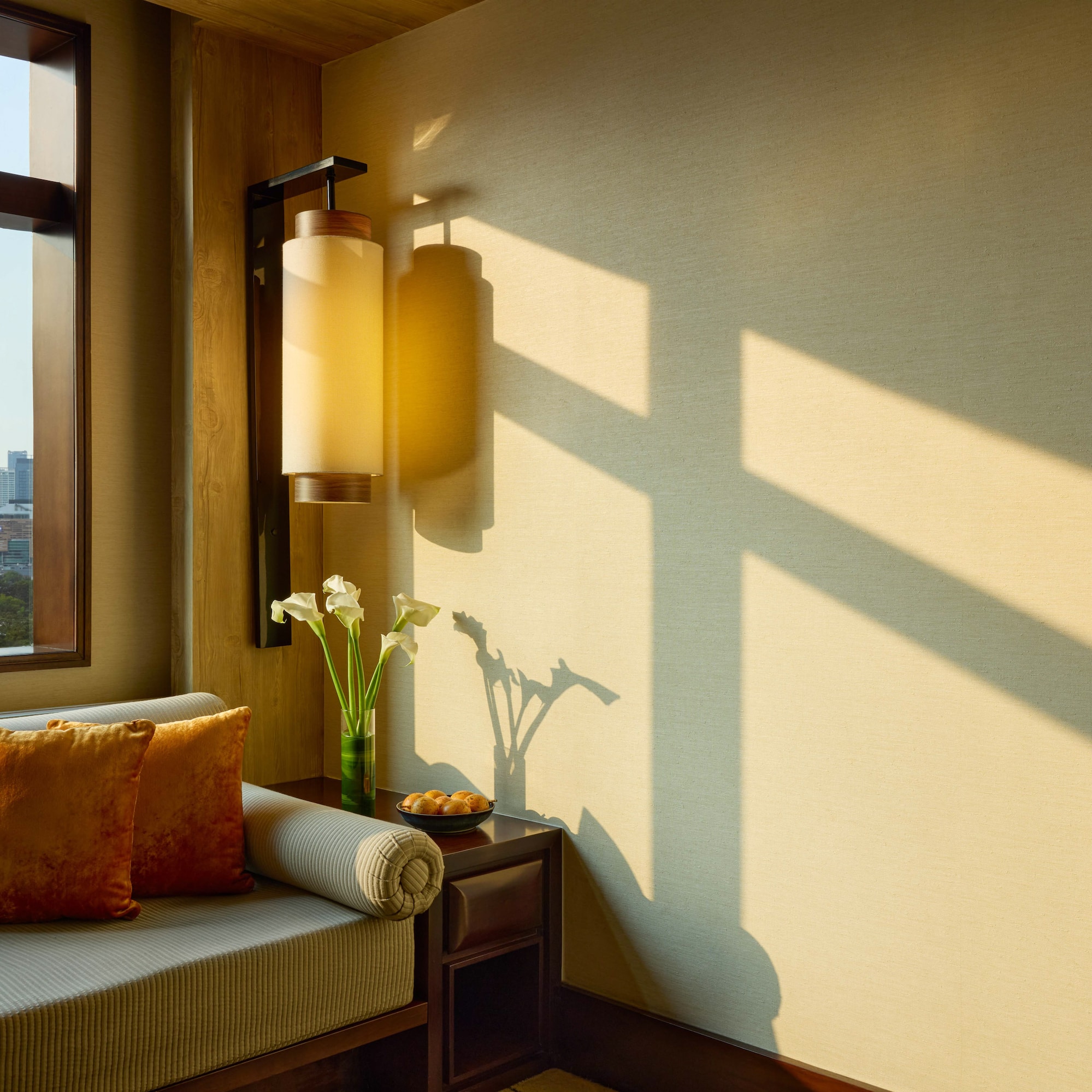 a room with a couch and a lamp