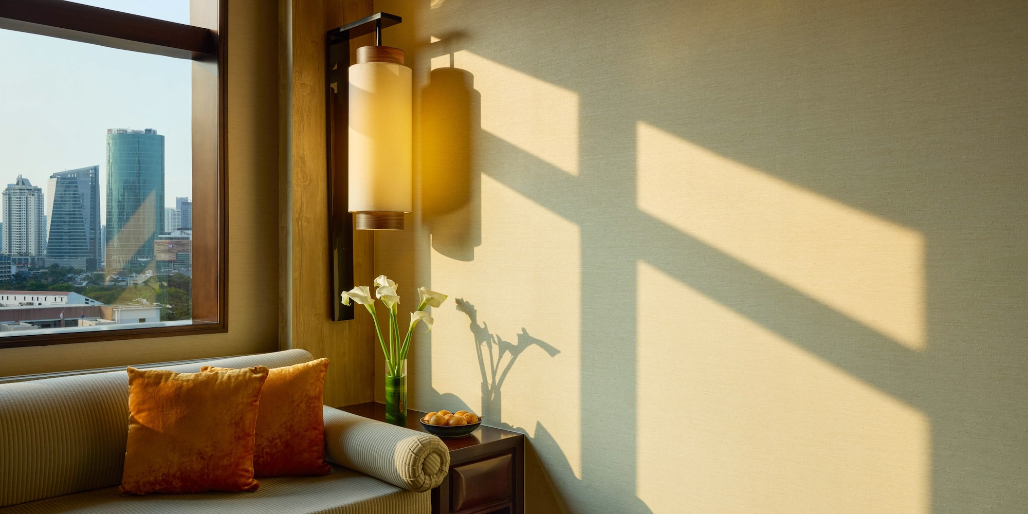 a room with a couch and a lamp