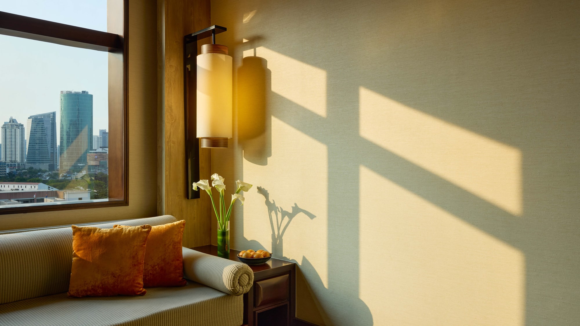 a room with a couch and a lamp