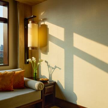 a room with a couch and a lamp
