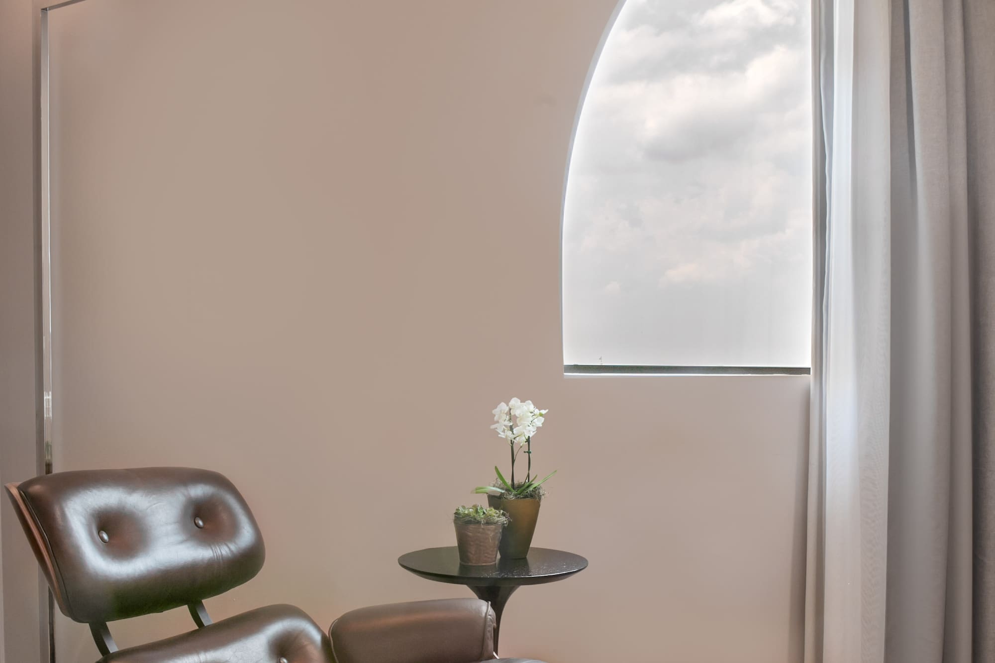 a chair and ottoman in a room