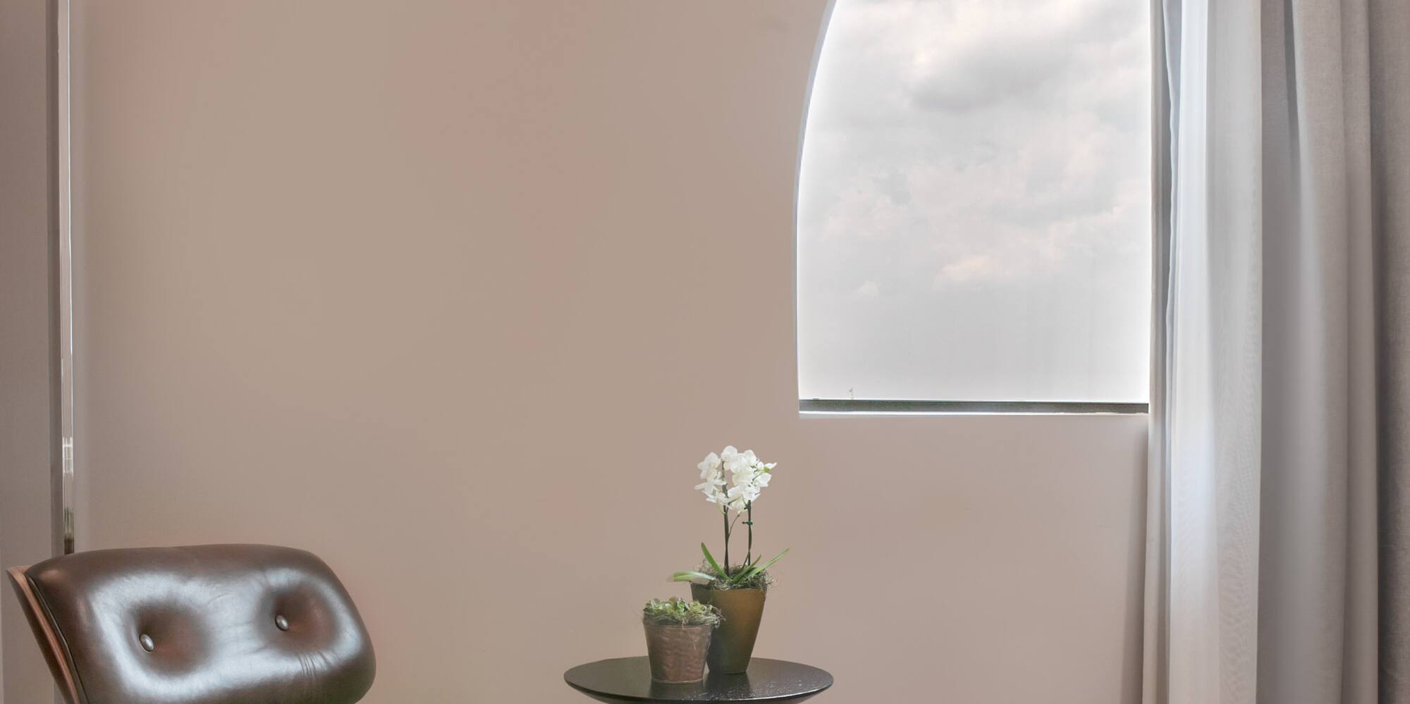 a chair and ottoman in a room