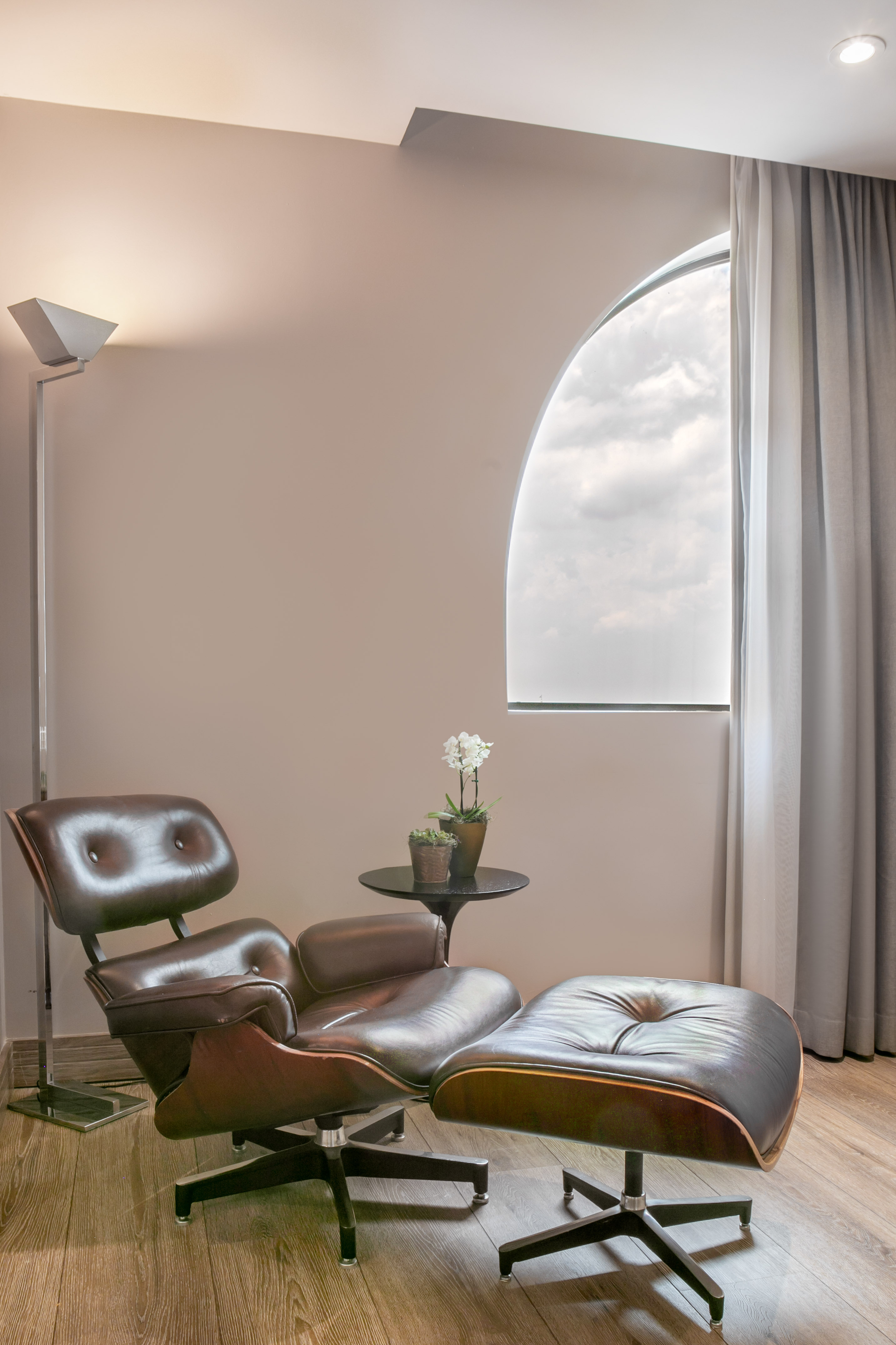 a chair and ottoman in a room