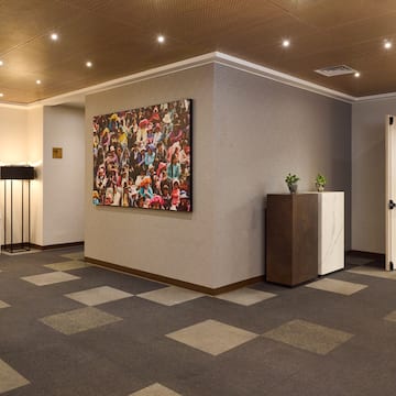 a room with a painting on the wall