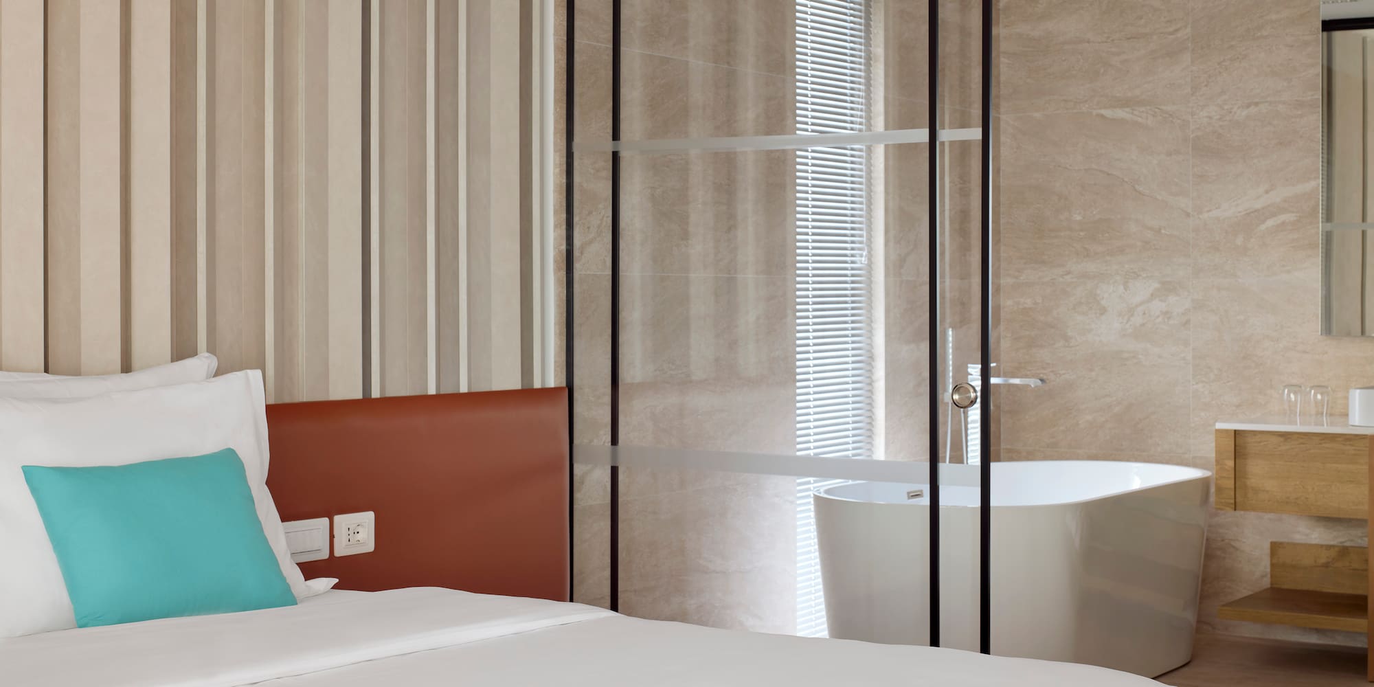 a bed with a bathtub in a room