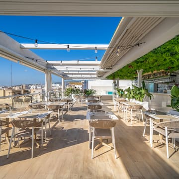 a restaurant with tables and chairs