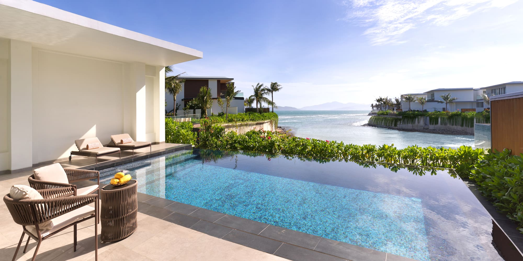 a swimming pool with a view of the ocean