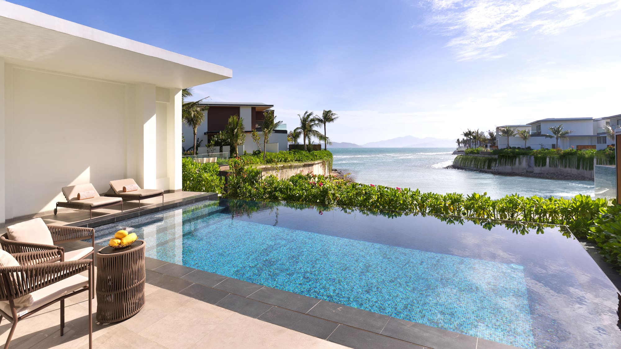 a swimming pool with a view of the ocean
