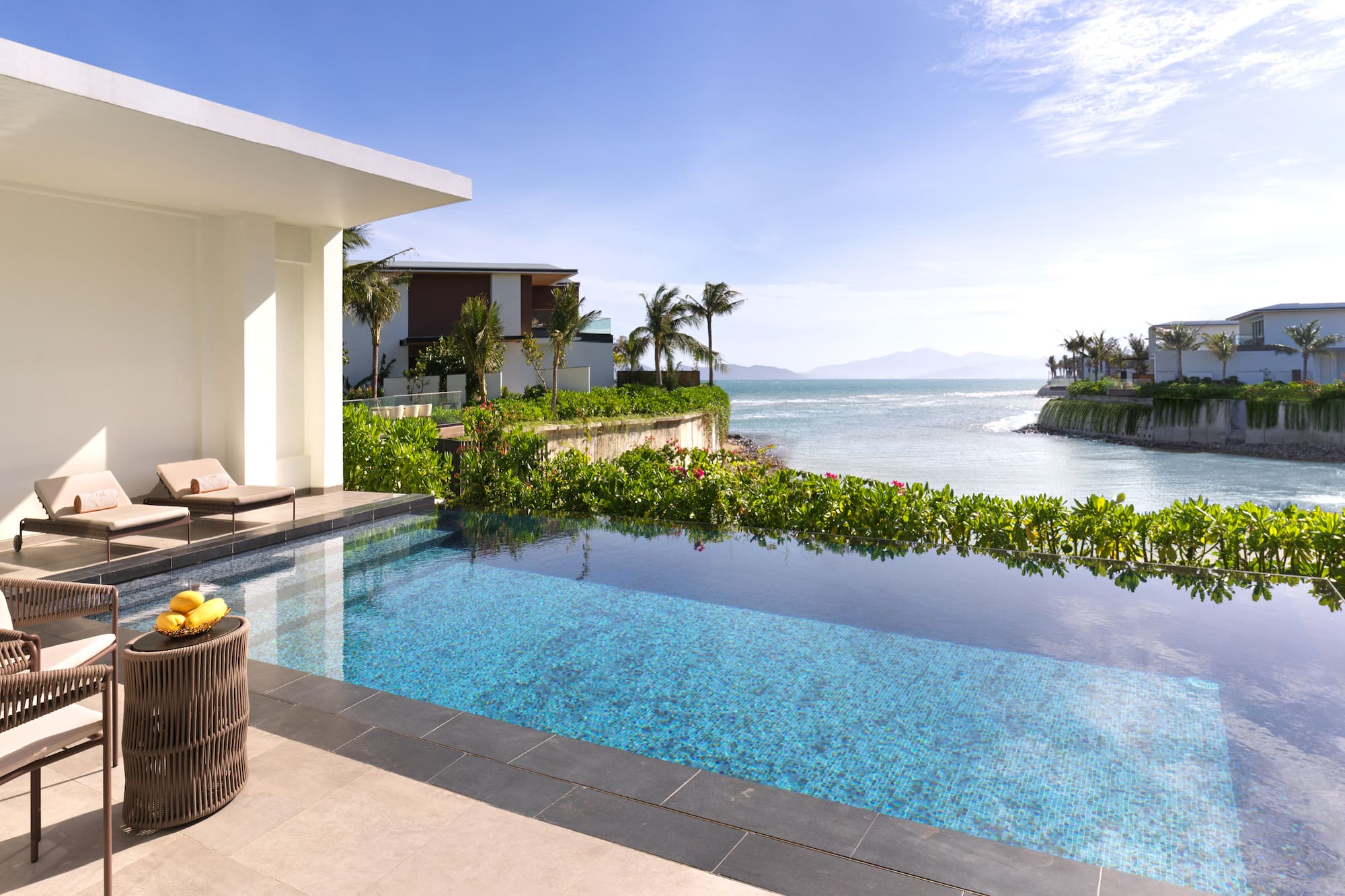 a swimming pool with a view of the ocean