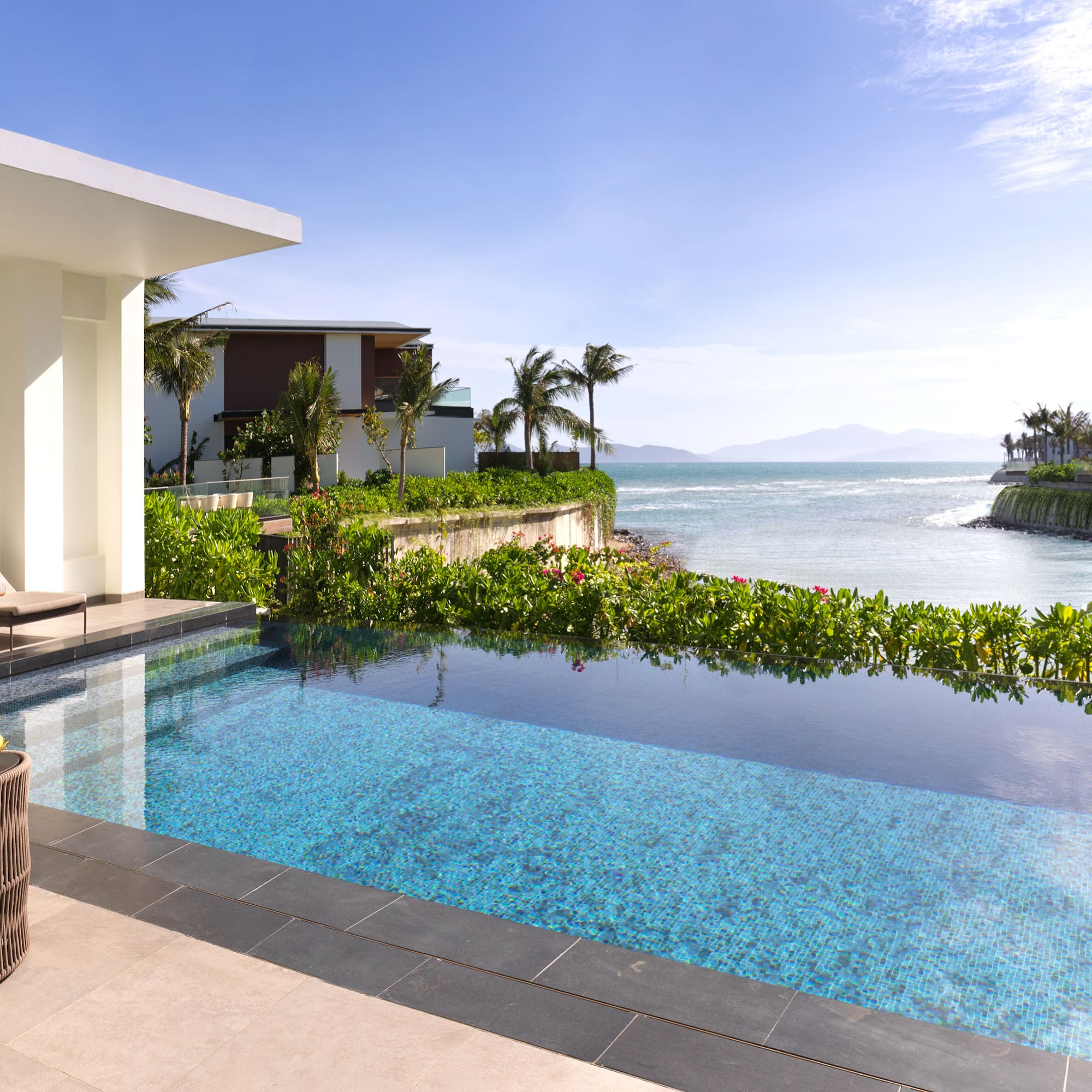 a swimming pool with a view of the ocean
