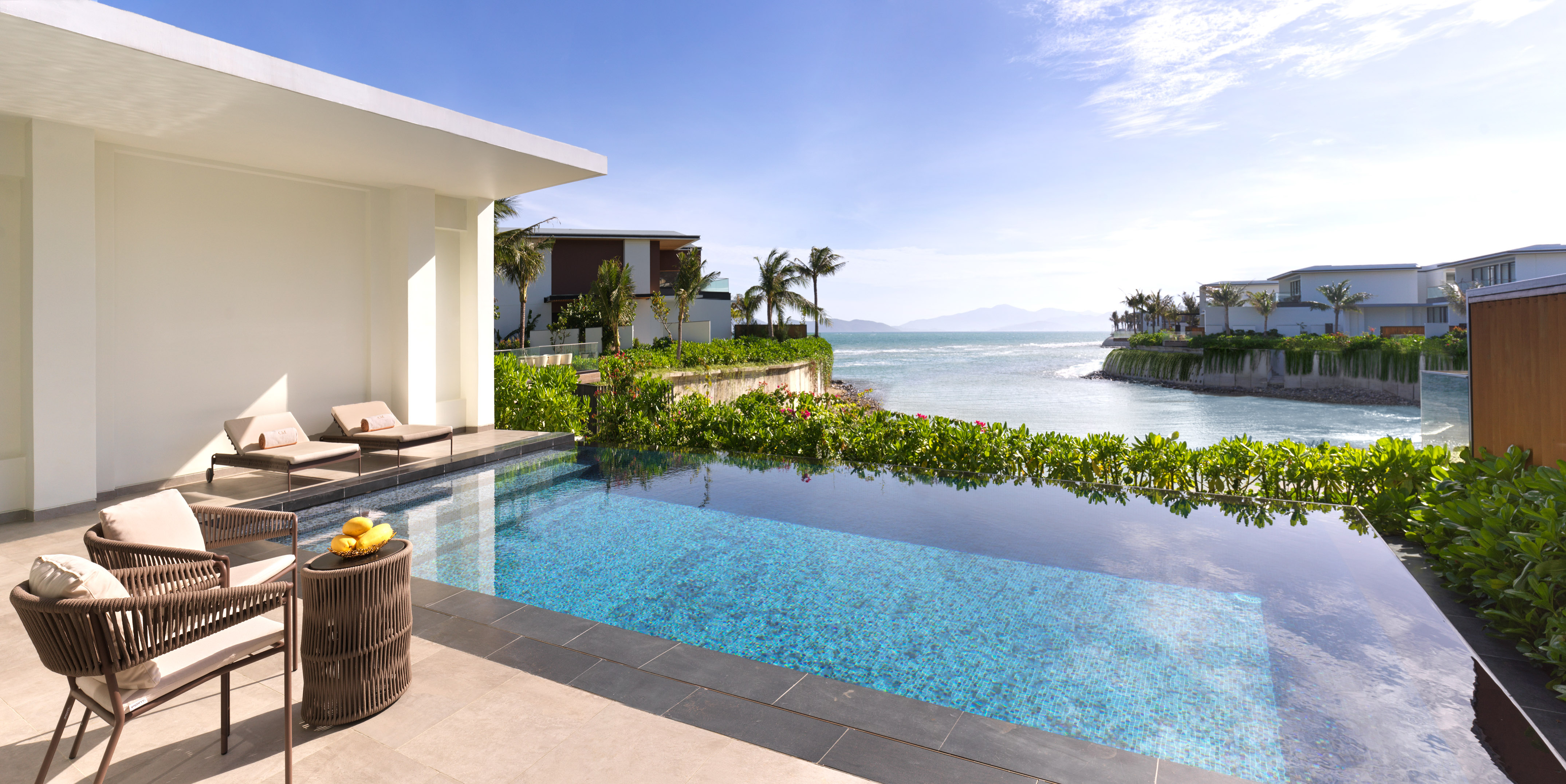 a swimming pool with a view of the ocean