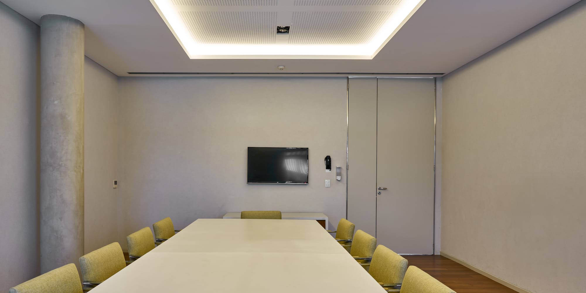 a room with a table and chairs