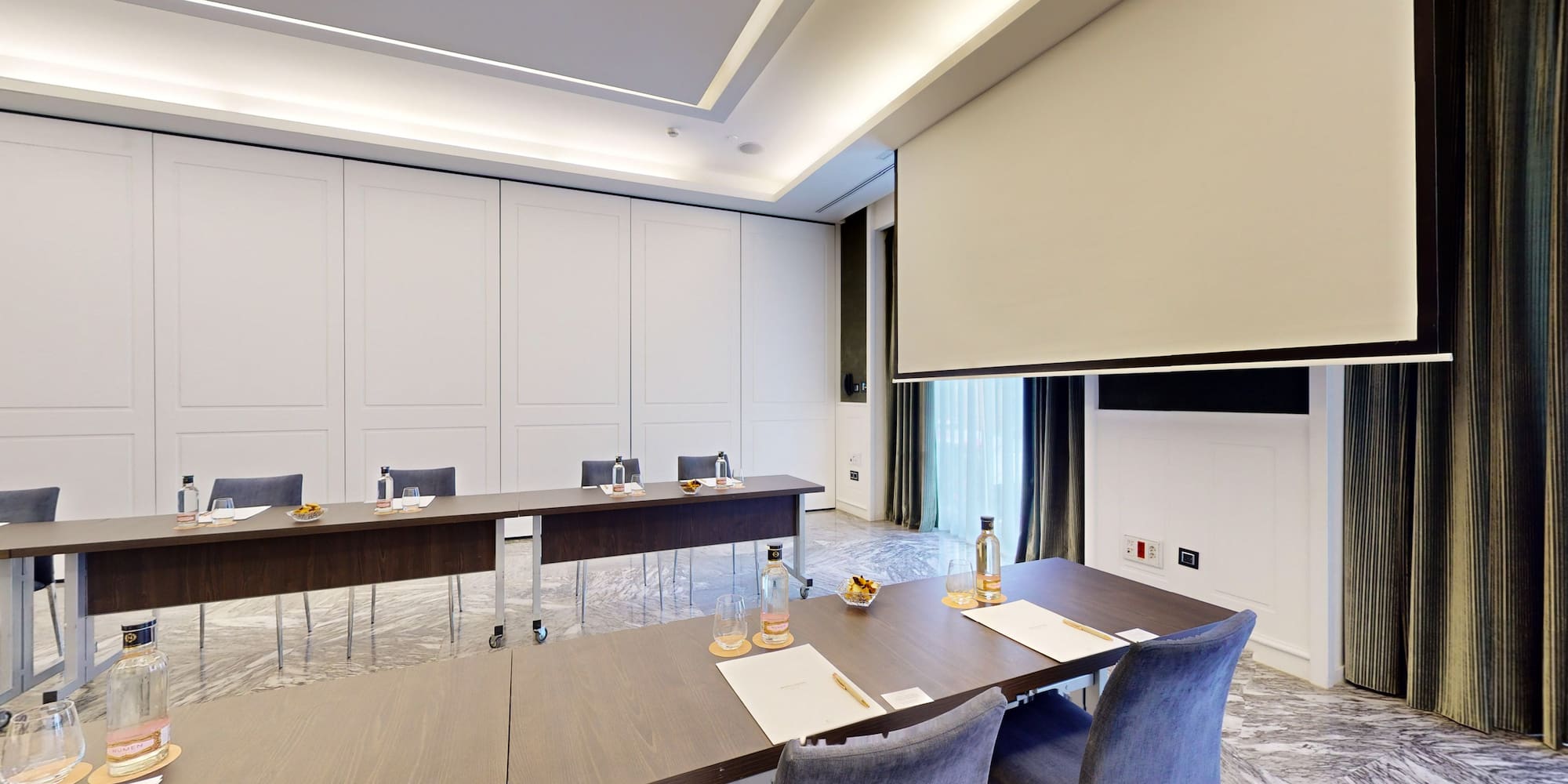 a room with a table and chairs